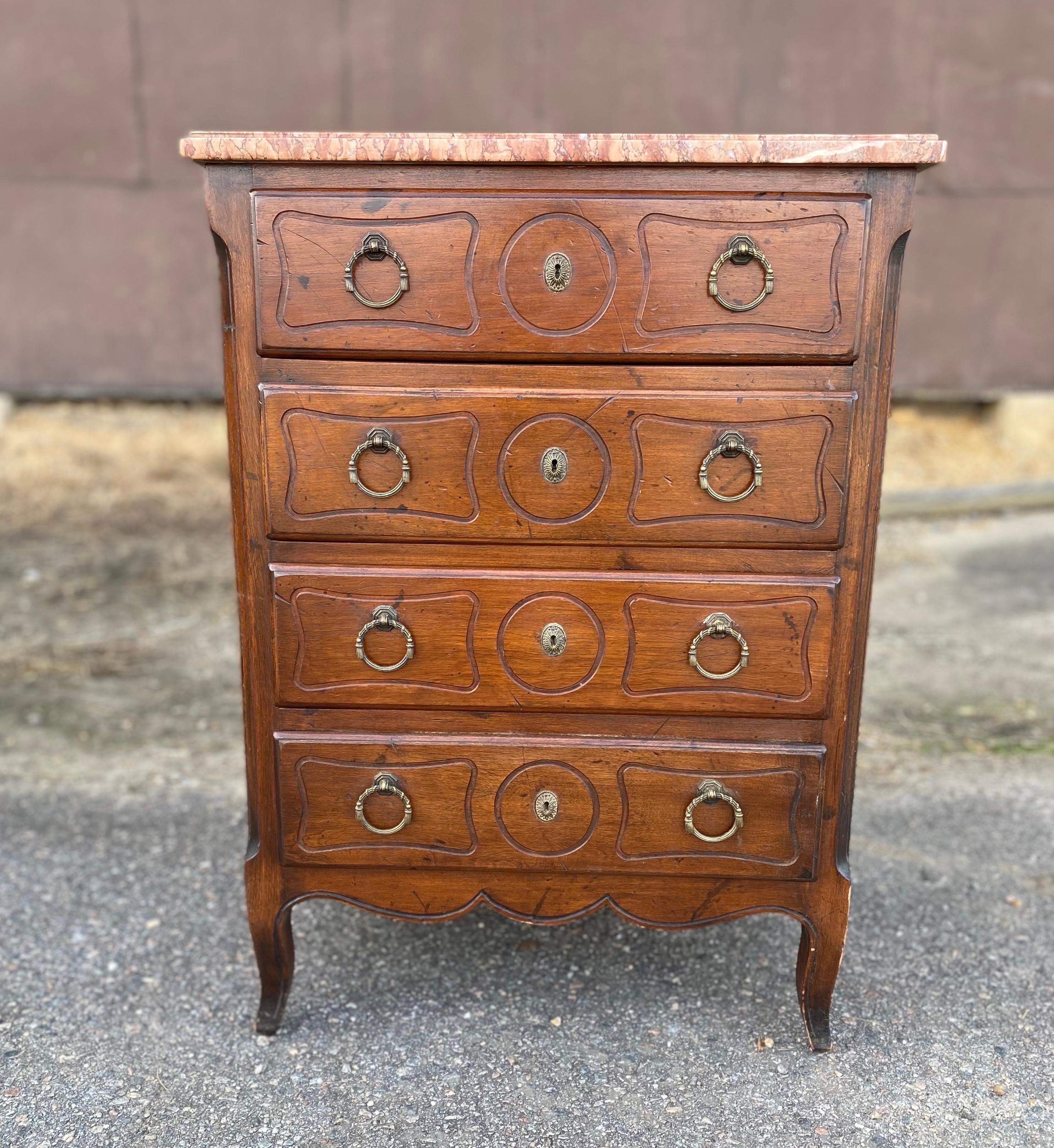 Great little 19th century French marble top chest with canter corners, shaped marble top and French feet. Great height and size for a bedside chest or side table.