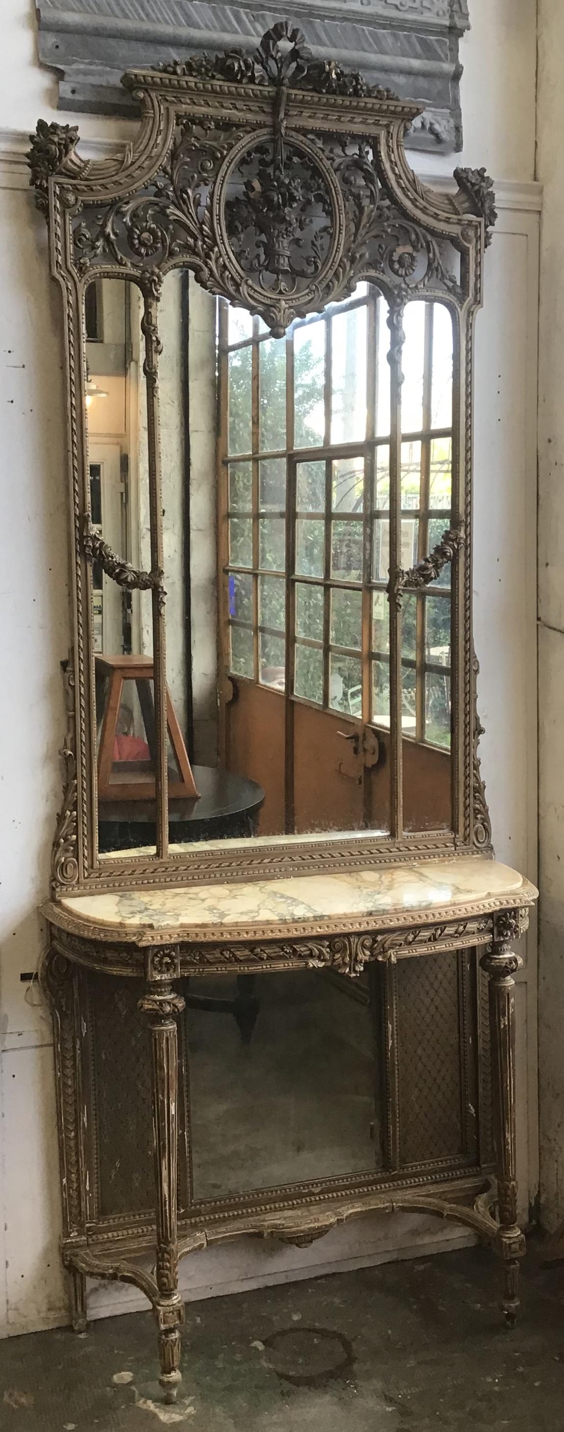 19th century French marble-top console table with giltwood framed mirror from 1890s.