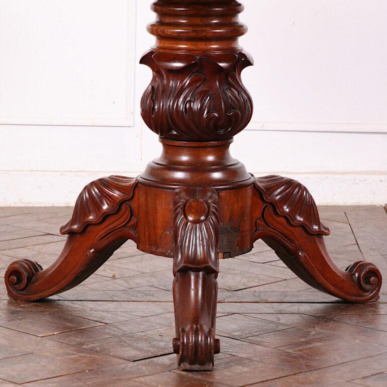 19th century French carved mahogany ‘gueridon’ or centre table with a boldly-turned and carved column support raised on three carved legs, and with the original grey marble round top with molded edge. C. 1870,


 