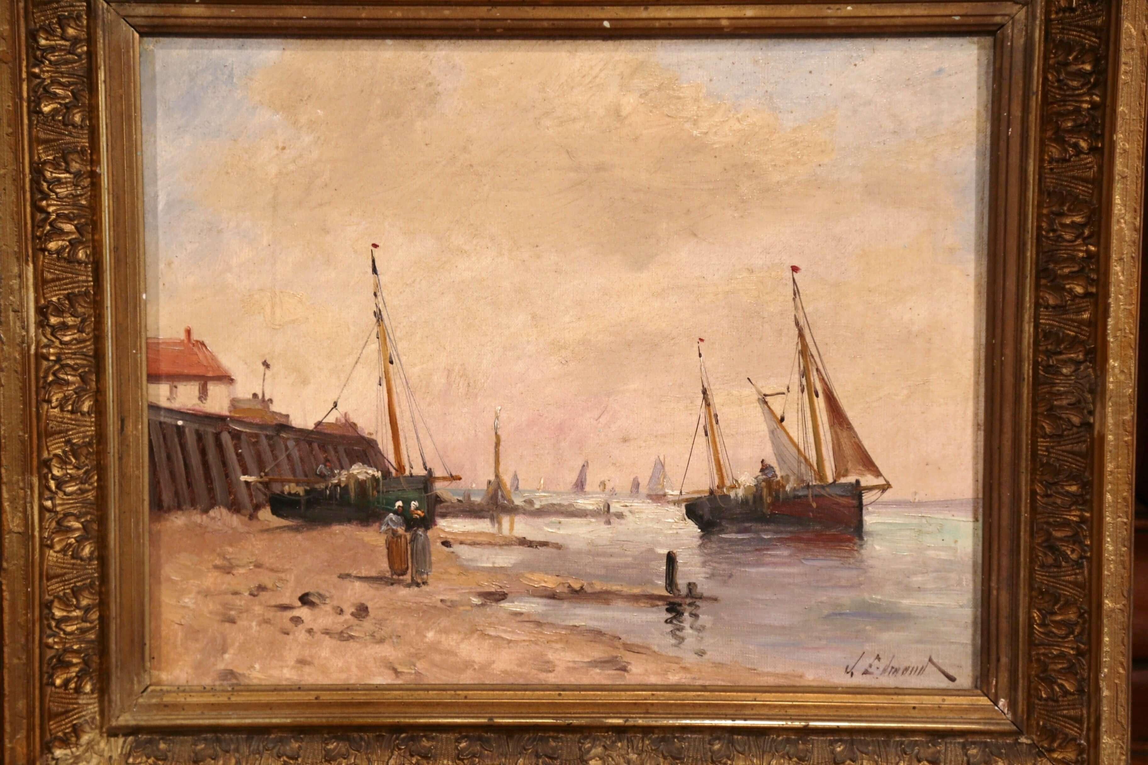 This colorful antique composition was painted in France, circa 1860. Set inside the original carved gilt wood frame, the hand painted artwork depicts a beach scene off the Brittany coast in the manner of Eugene Galien-Laloue. The composition shows