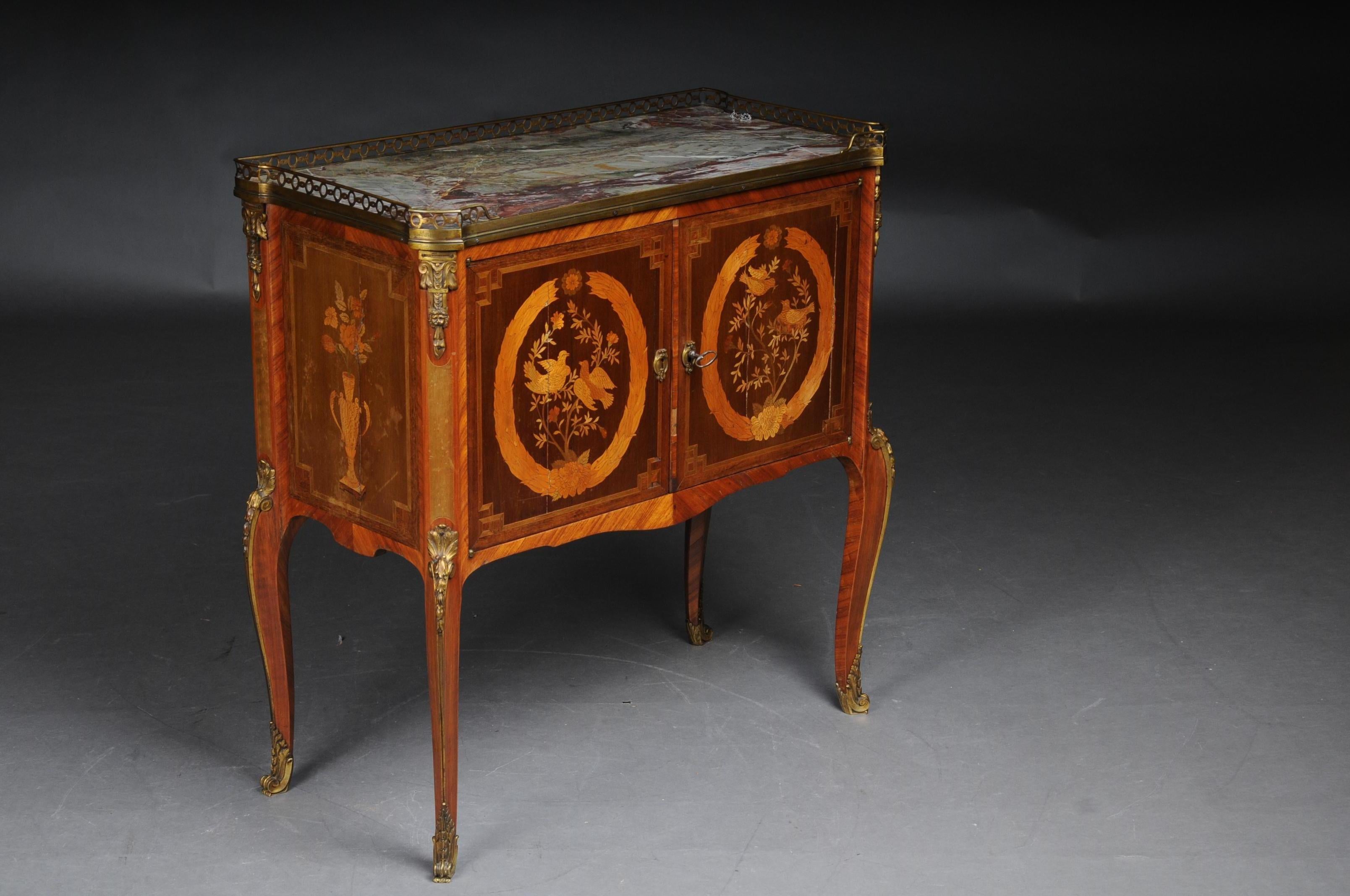French marquetry dresser Transition, Napoleon III, circa 1870

Marquetry: wood on solid oak body. Marbled and profiled marble top. Fire-gilt bronze fittings. Fine and time-typical lines, a dresser of the highest quality.

(D-84)..
