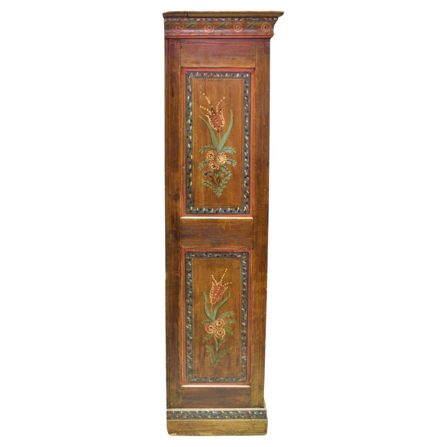 A lovely dowry armoire from the Alsace region of France with folk-painted artwork. Features vases with stylized flowers & doves, symbols of fertility & a fruitful union, over a maroon tooled & grained background embellished with foliage. Colors