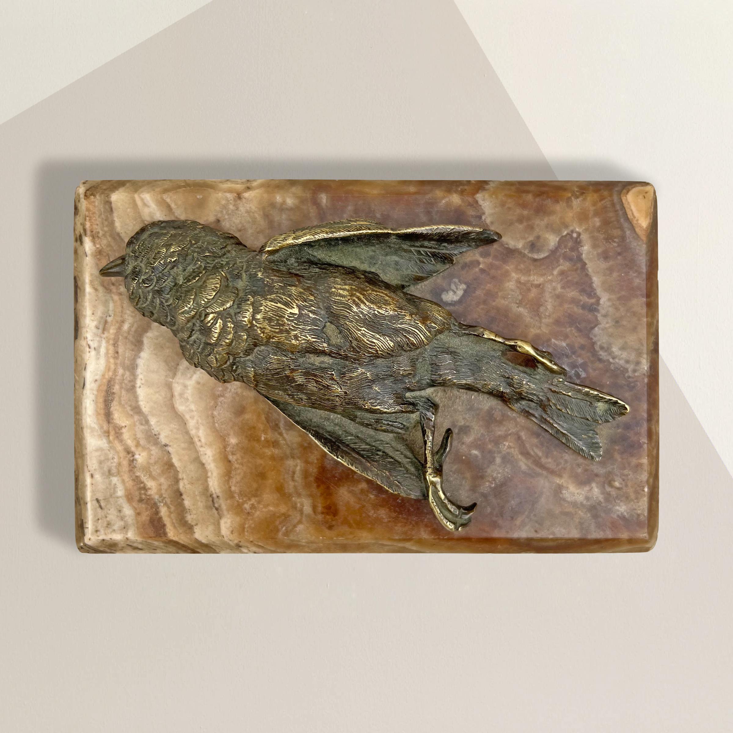 A striking and thought-provoking 19th century French cast bronze Memento Mori figure depicting a dead finch resting on an onyx pedestal. Memento Mori appear morbid but, in fact, were intended to be reminders of how fleeting life is, and how one