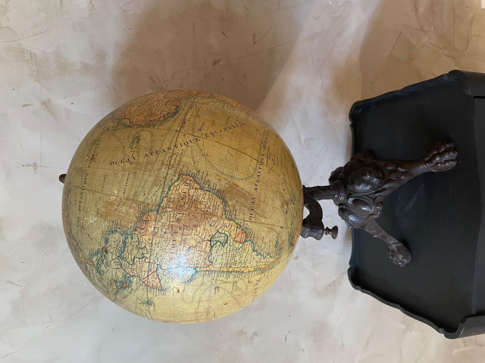 Exceptionnal 19th century French Paper and metal World globe from the 1880s. 
Stamp of the French manufacturer J.Lebegue & cie on the globe. 
The base in in metal and is representing the faces of three continents (Africa, America and Asia).
Some