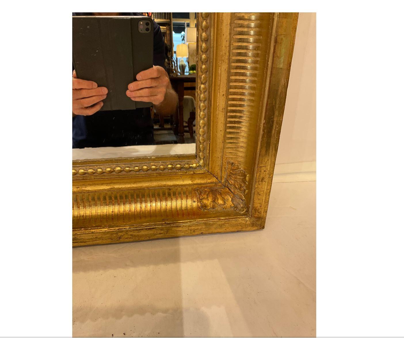 This is a beautiful 19th century French square mirror. Gold gilt on the entirety of the mirror, it also has hand carved floral embellishments on all four corners. What makes this mirror so unique is it’s all original including the mirror! A mirror