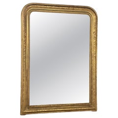 19th century French mirror in gilded wood with floral decorations 19th century French mirror in gilded wood with floral decorations