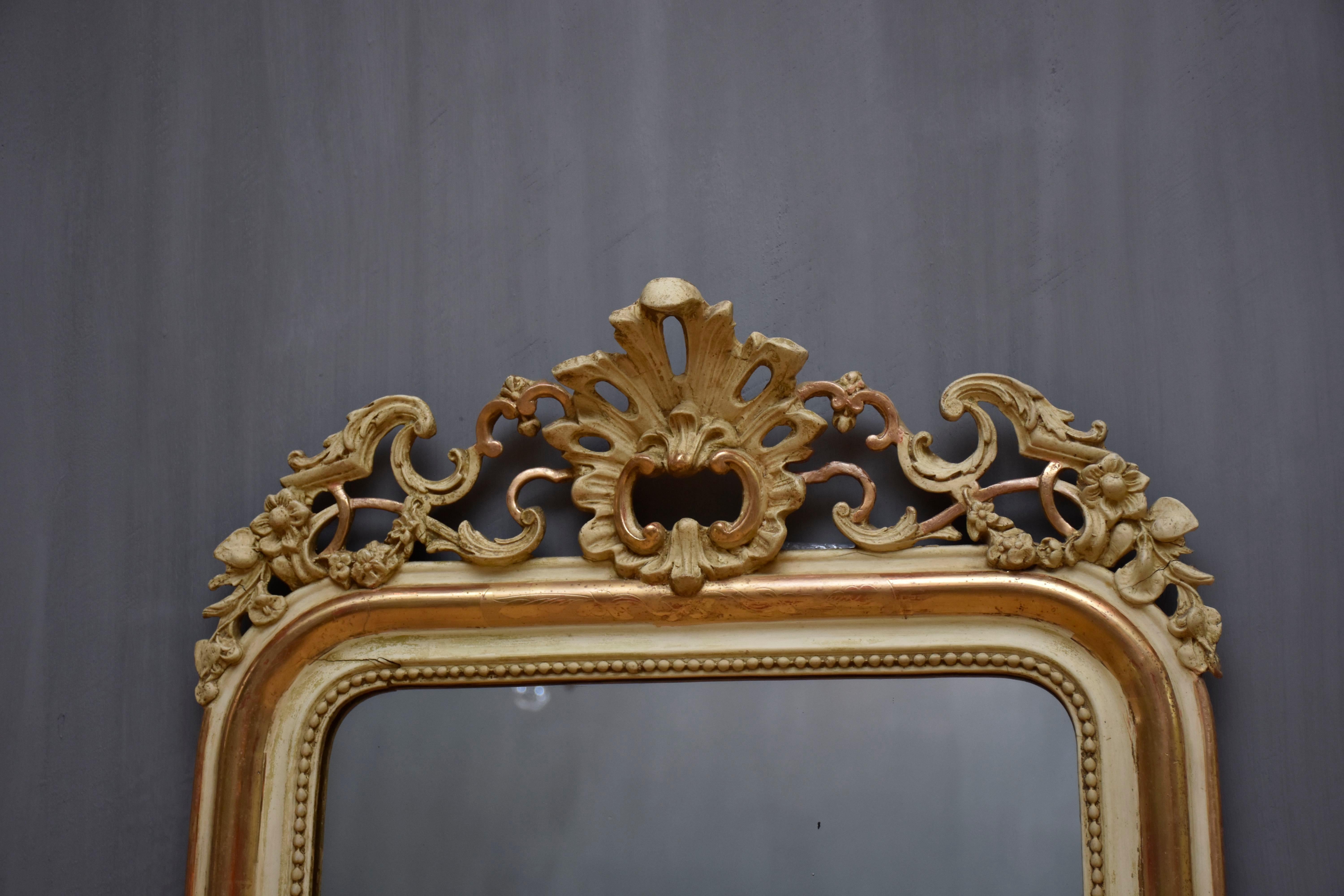 Gilt 19th century French mirror Louis-Philippe with a crest For Sale
