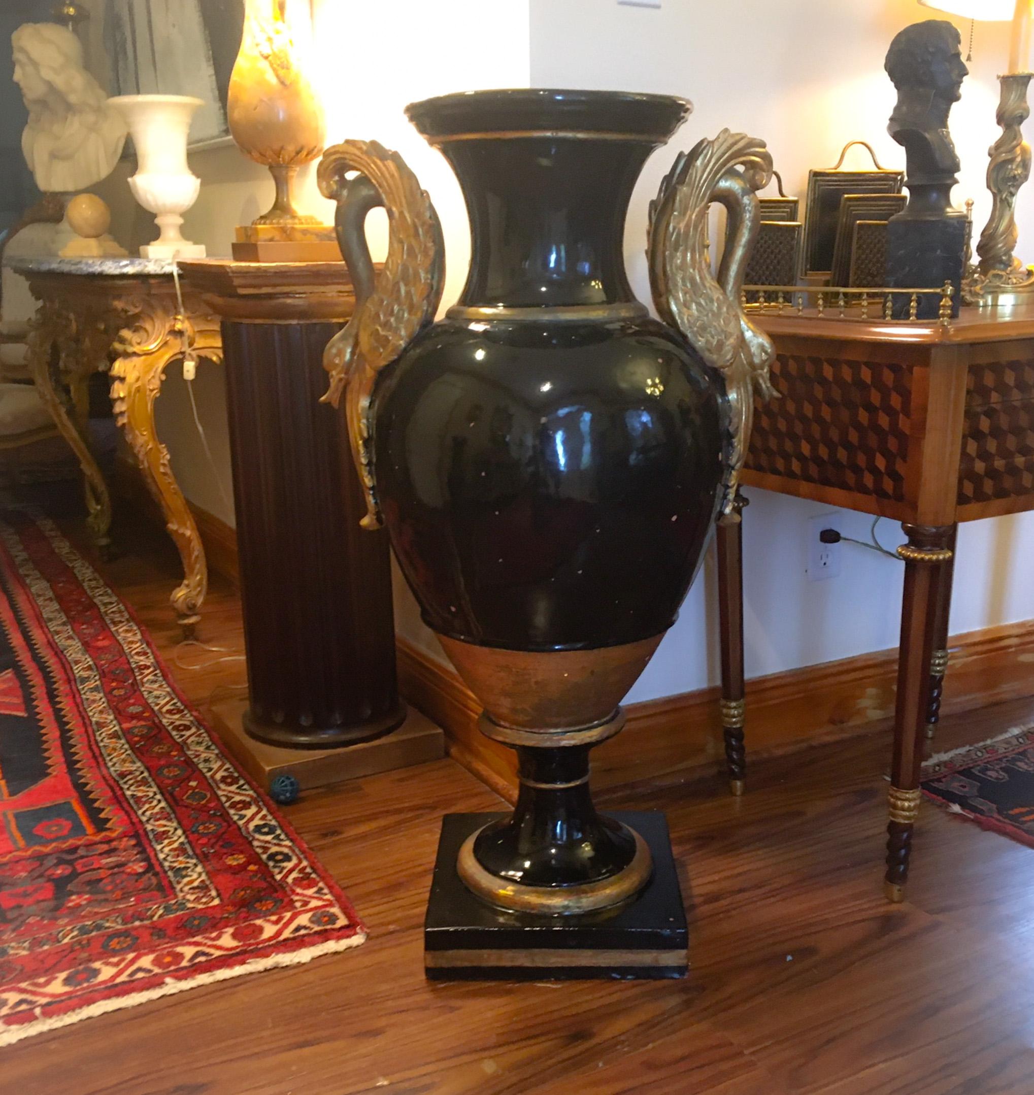 19th century French monumental terracotta cobalt blue glazed vase-urn

This elegant palace sized French cobalt blue glazed terracotta floor vase from the 
19th century, is a stunning statement piece. It is extremely rare in this size. The classic