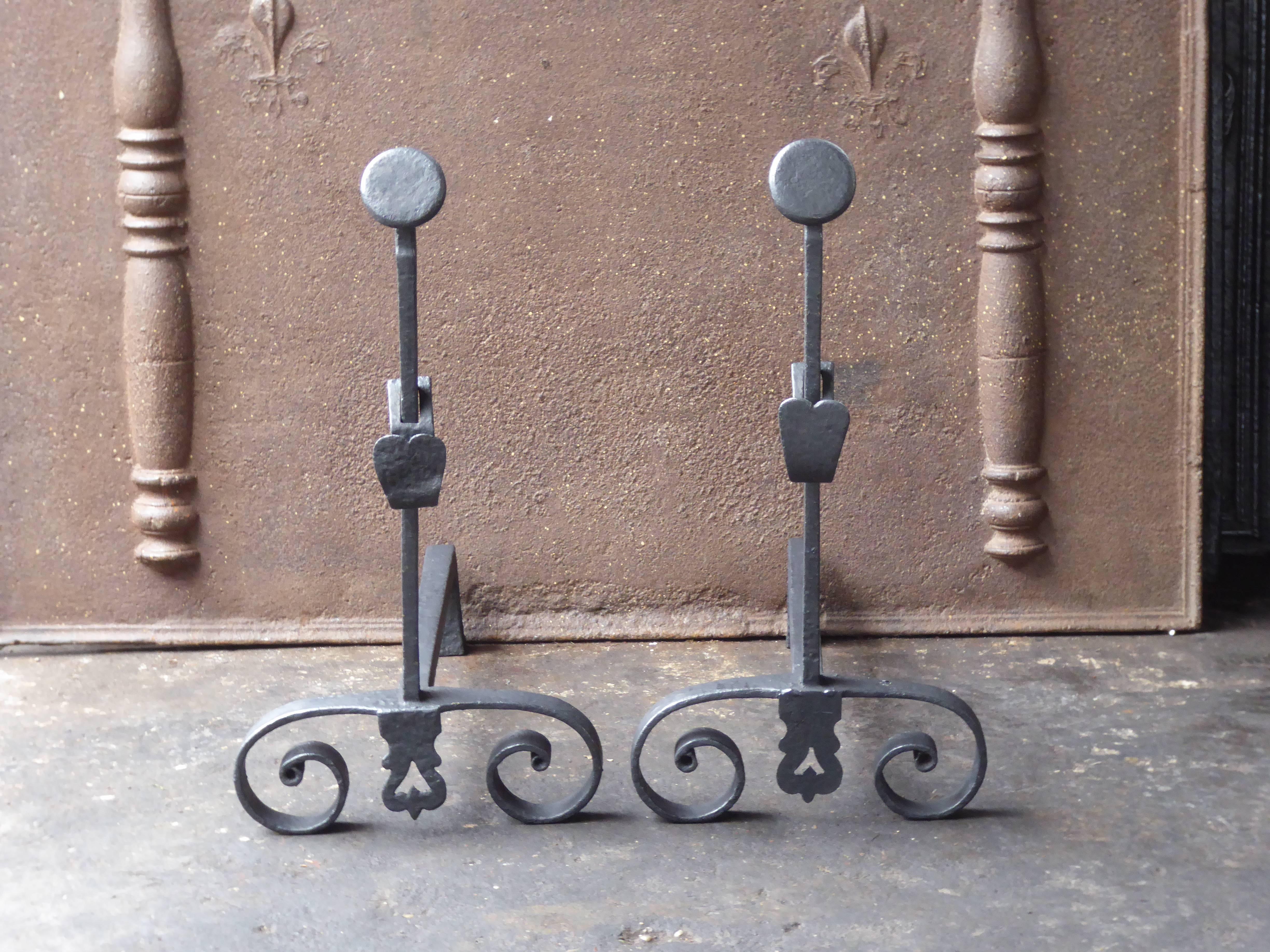 19th century French Napoleon III andirons made of wrought iron.

We have a unique and specialized collection of antique and used fireplace accessories consisting of more than 1000 listings at 1stdibs. Amongst others, we always have 500+ firebacks,