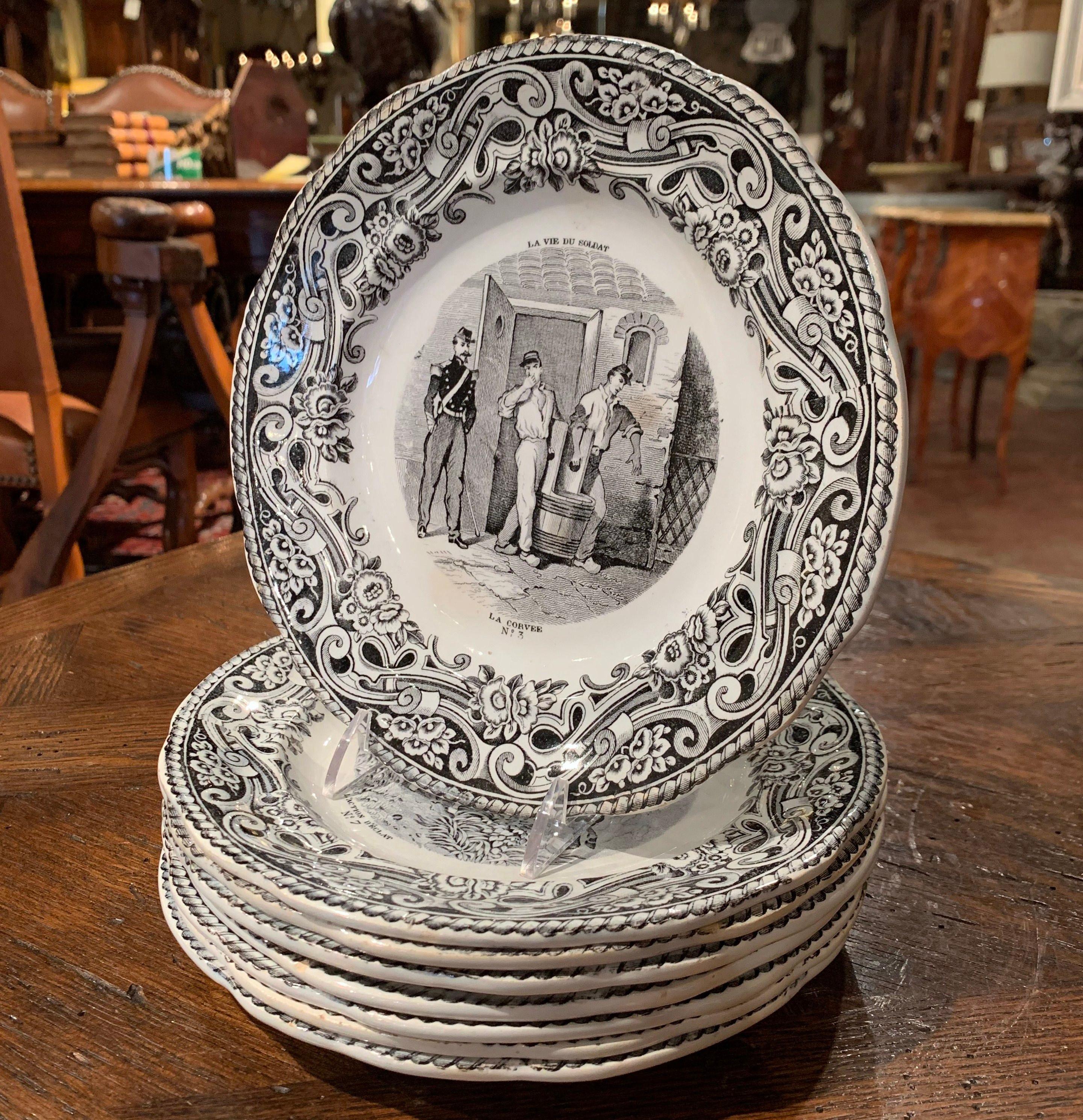 This elegant set of eight antique plates was crafted in France, circa 1870. Each hand painted plate with French wording illustrates a scene depicting the 