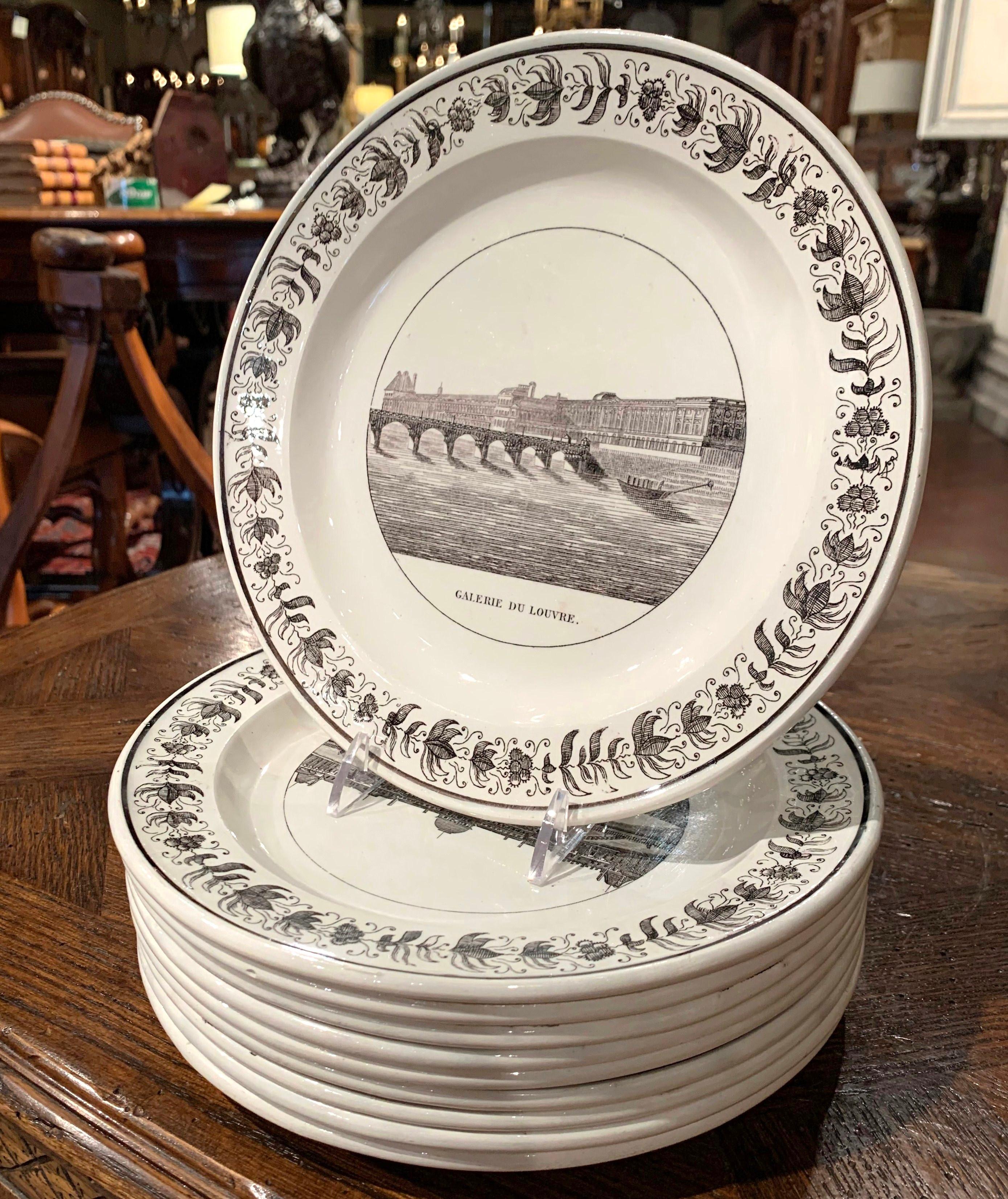 This elegant set of ten antique plates was crafted in Montereau, France, circa 1870. Each hand painted plate features an illustrated scene of Paris; the landscapes include silhouettes of famous Paris monuments such as 