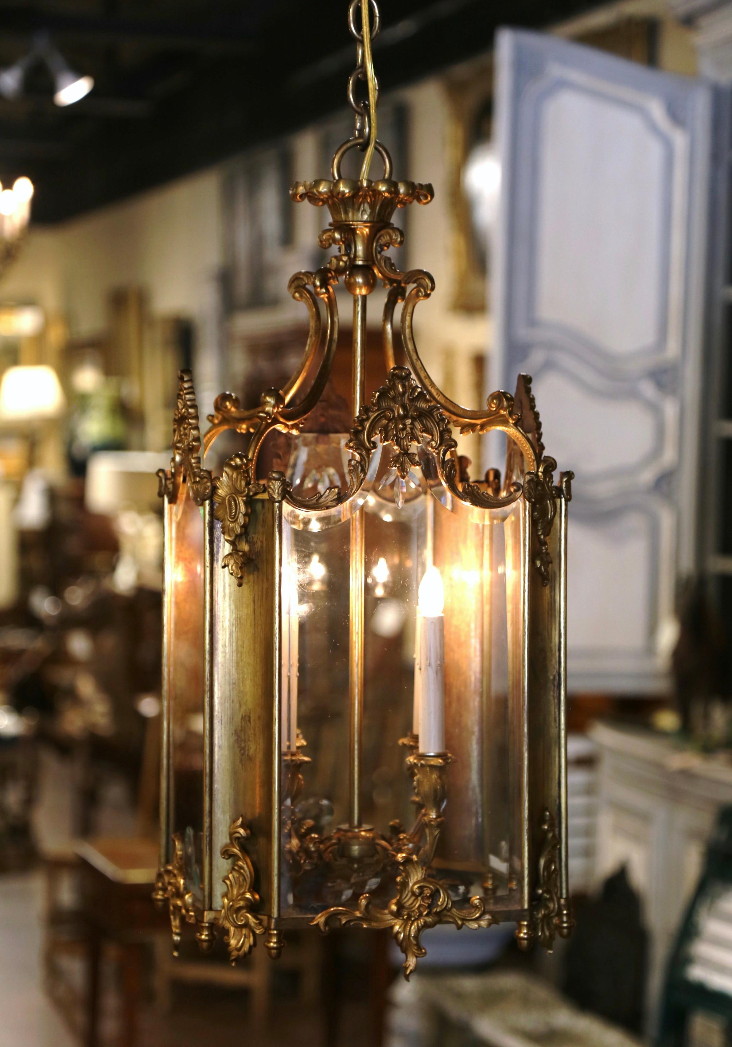 Make a statement in your entryway or powder room with this elegant Napoleon III bronze dore fixture. Crafted in France, circa 1870, and square in shape, the antique lantern features a top crown decorated with scroll and acanthus leaf decor; the