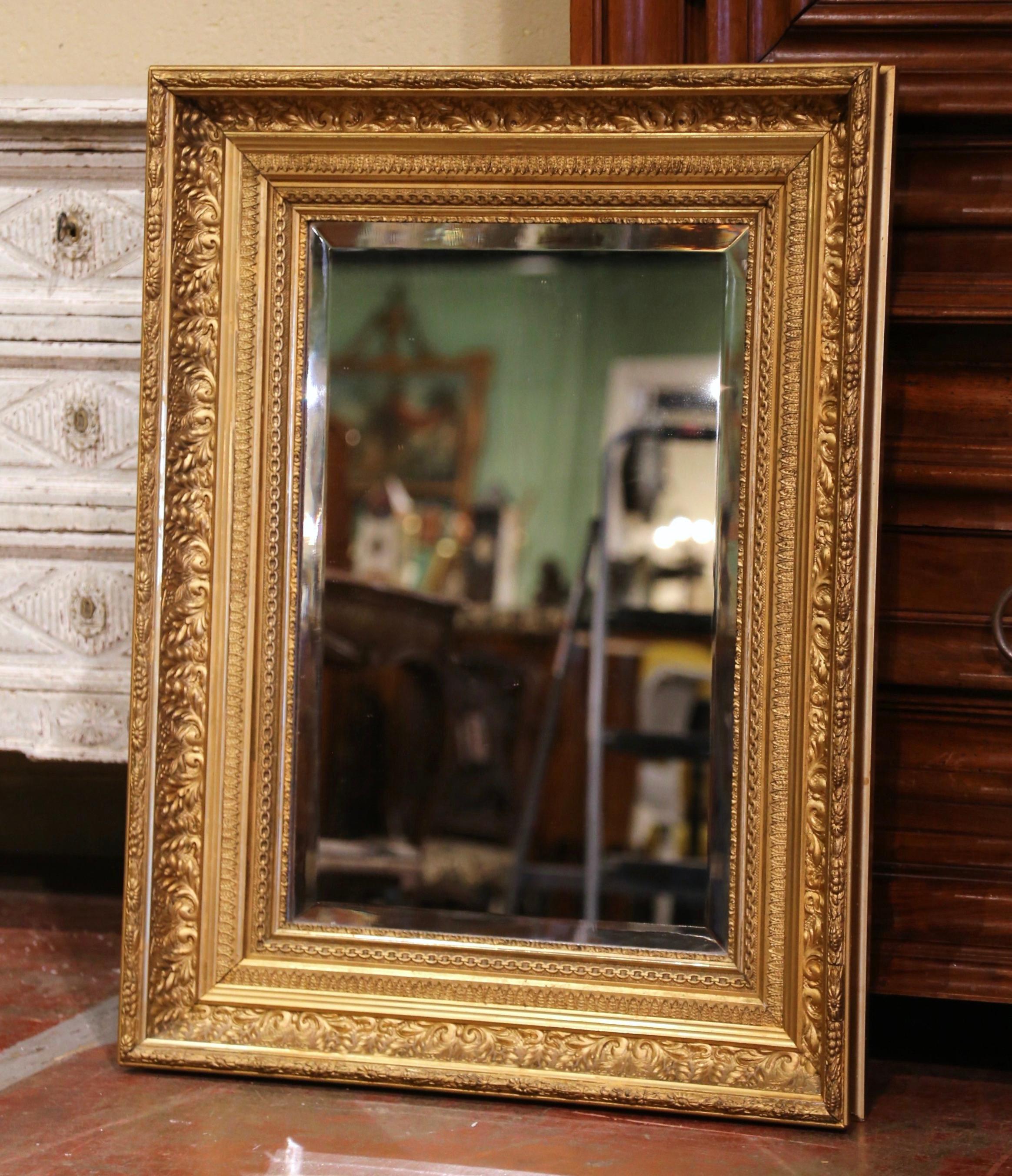 Decorate a powder room, entryway or bedroom with this elegant antique gold leaf mirror. Crafted in the Burgundy region of France, circa 1870, the rectangular mirror has traditional lines decorated with carved floral, leaf and fruit motifs in high