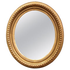 19th Century, French, Napoleon III Carved Giltwood Oval Wall Mirror