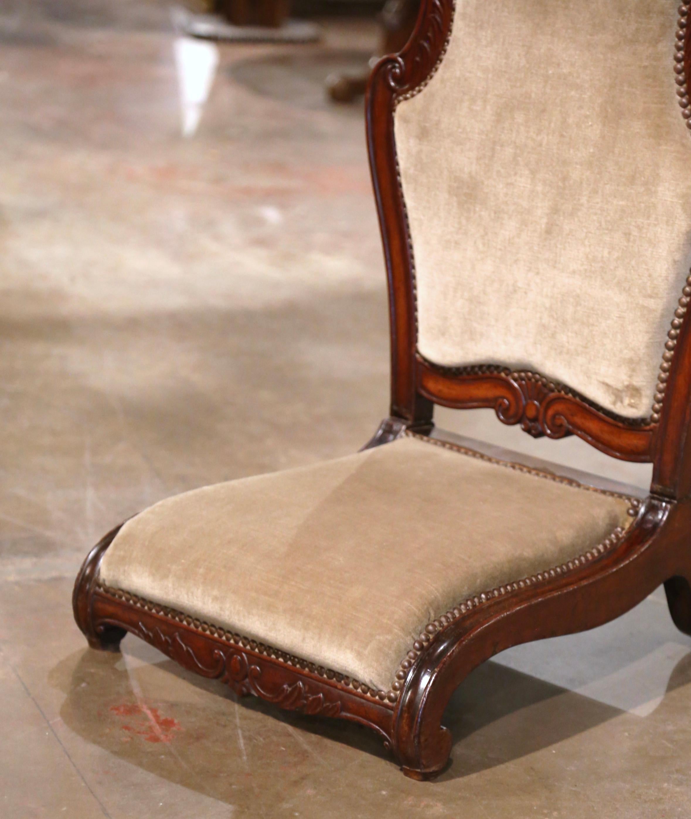 Place this elegant antique prayer chair in a bedroom for your daily devotions! Crafted in France, circa 1870, the traditional mahogany kneeler sits on scrolled feet over a scalloped apron decorated with a carved shell and foliage. The chair with a