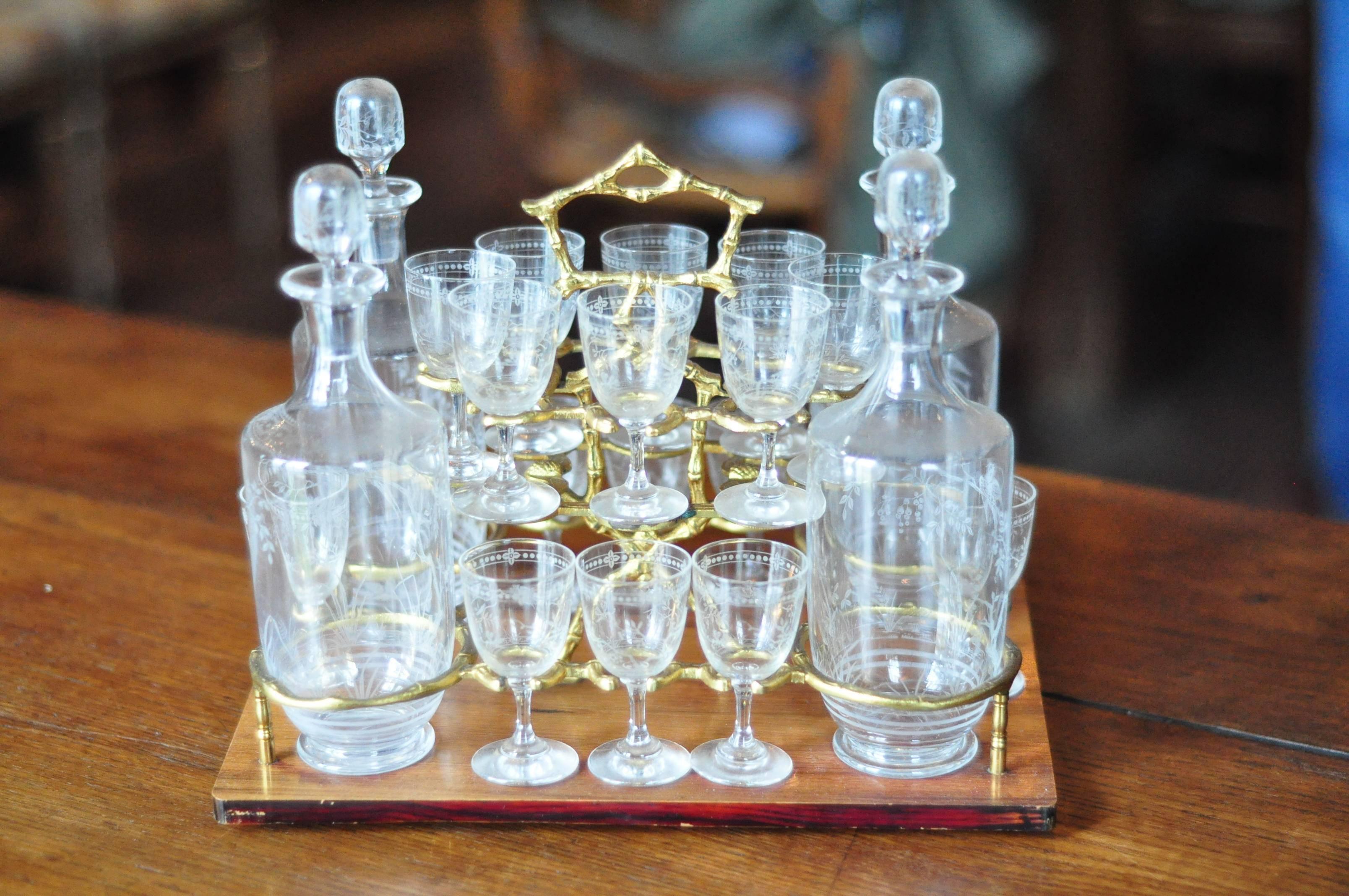 Gorgeous 19th century French Napoleon III cave à liqueur with Marquetry Boule. Includes four carafes and 16 glasses, all Baccarat crystal.
 