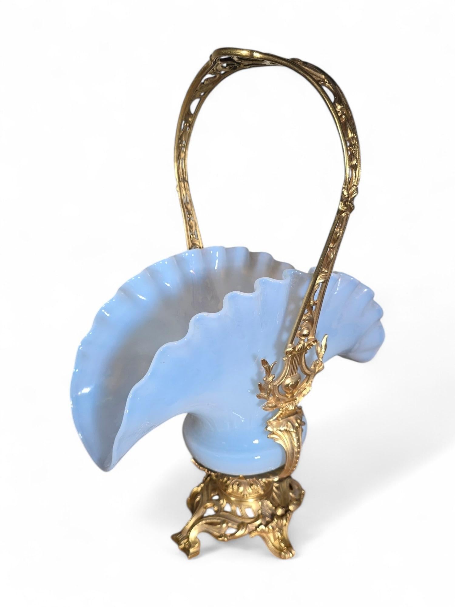 An elegant French centerpiece from the Napoleon III era, crafted in gilt bronze and adorned with opaline glass. Dating to the 19th century, this exquisite piece exemplifies refined design and expert craftsmanship typical of the period.

Condition: