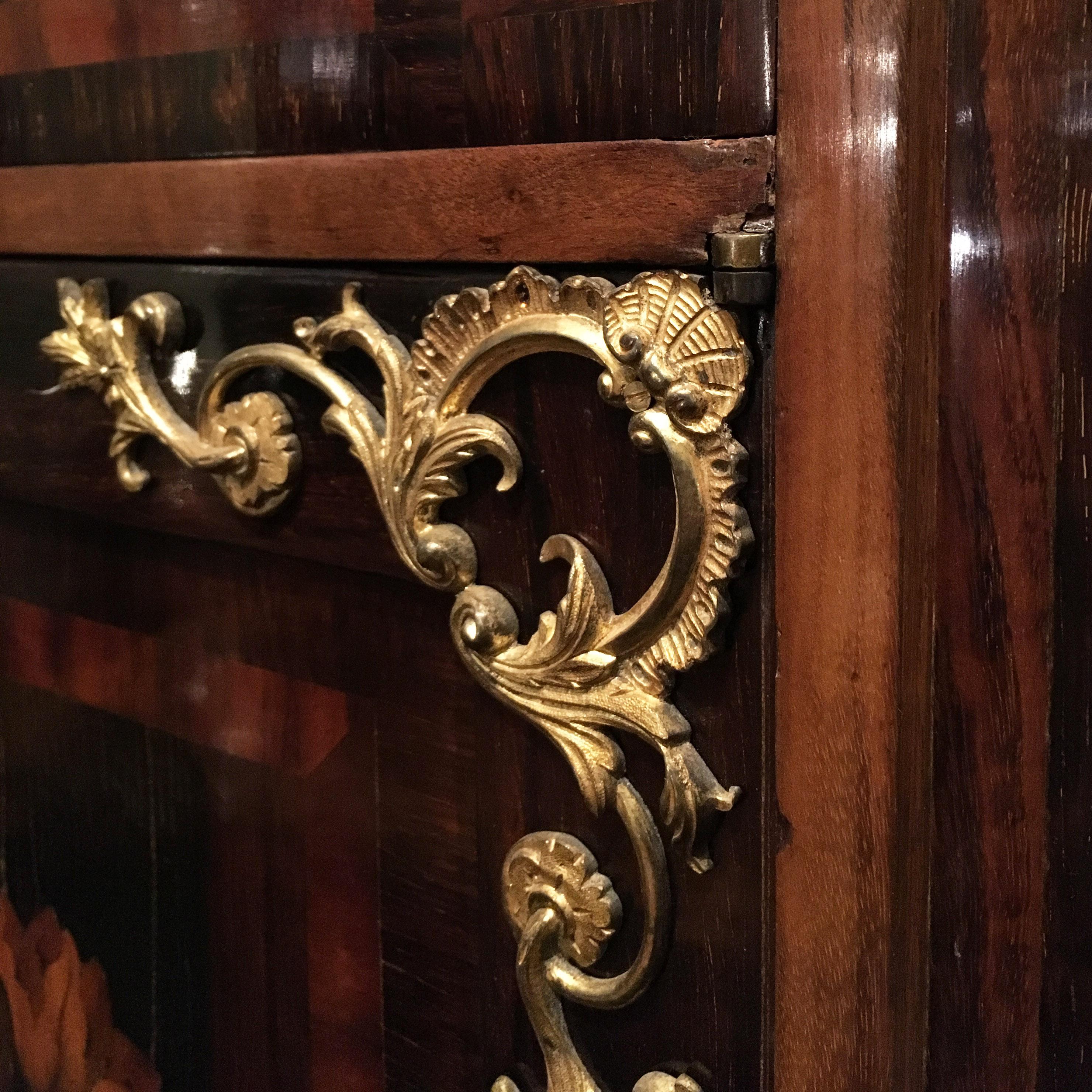 An elegant French Napoleon III credenza in rosewood, palisander and walnut wood.
The credenza presents one door and two drawers, one on the top and the other one on the bottom of the piece, beautiful ormolu mountings and a red marble top.
France,