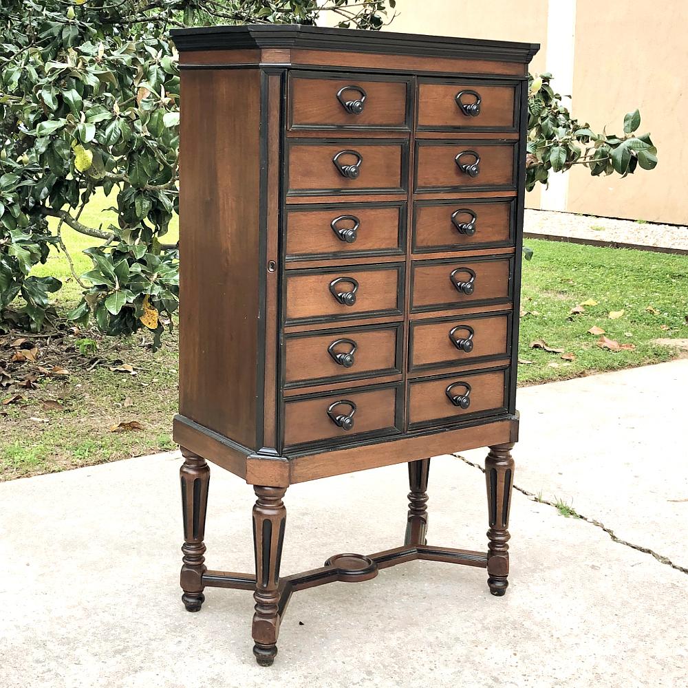 19th century French Napoleon III file cabinet is a stylish way to store your archives and files, and features no less than a dozen drawers with which to do so, supported by turned legs connected with stretchers below. The drawers are secured by