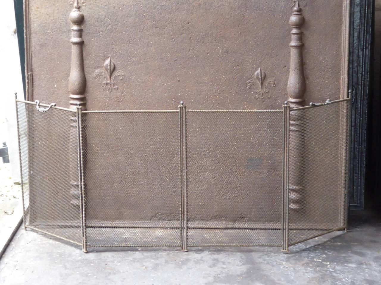 19th century French Napoleon III fireplace screen made of iron and iron mesh.