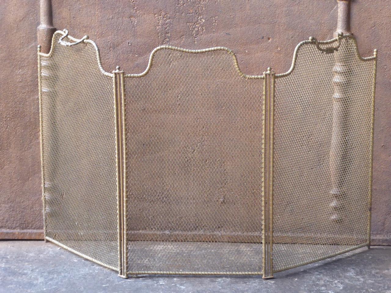 19th century French Napoleon III fireplace screen. The screen is made of brass, iron and iron mesh. It is in a good condition and is suitable for use in front of the fireplace.