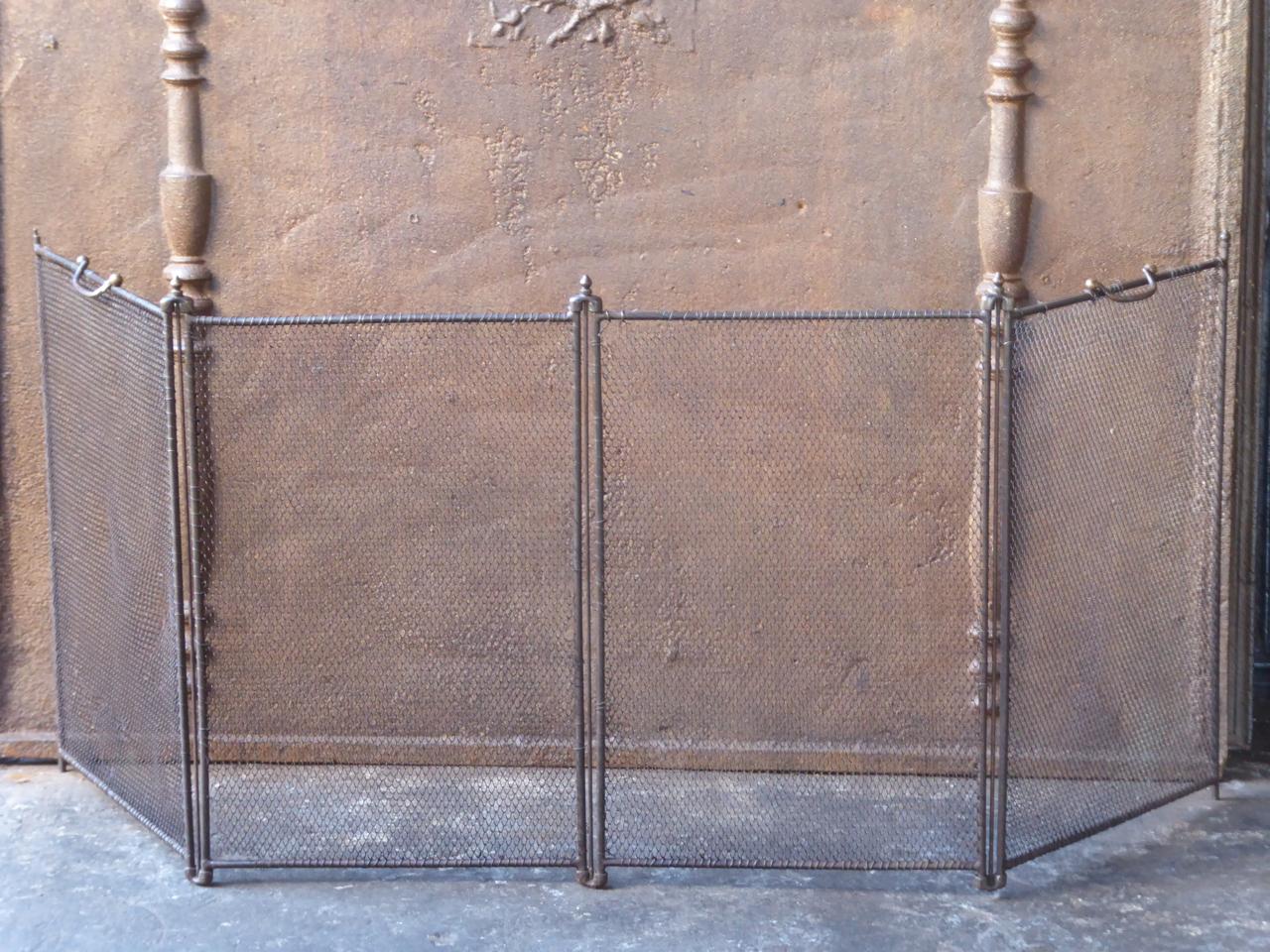 19th century French Napoleon III four panel fireplace screen. The screen is made of iron and iron mesh. It is in a good condition and is fit for use in front of the fireplace.