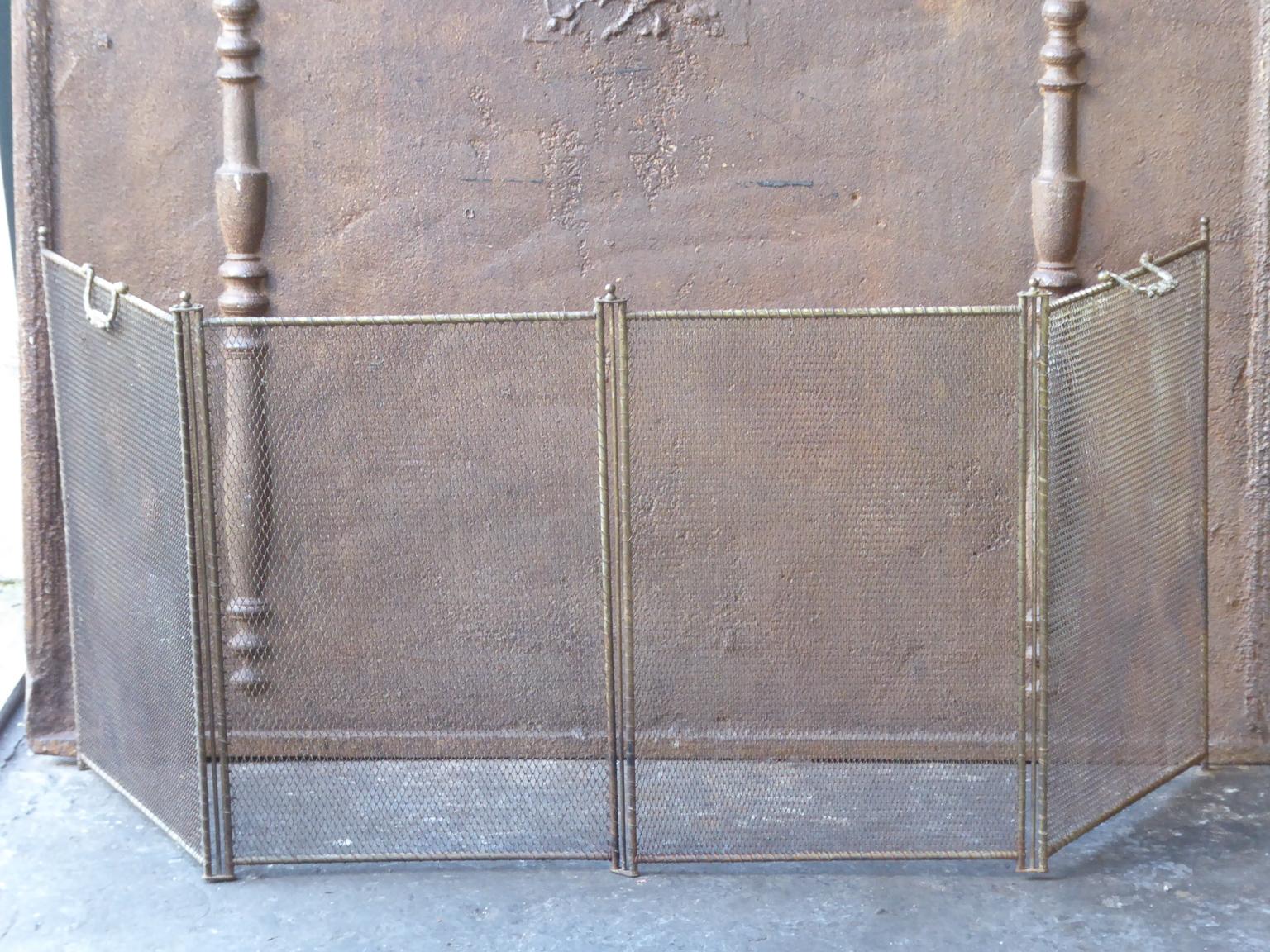 19th century French Napoleon III four panel fireplace screen. The screen is made of brass and iron mesh. It is in a good condition and is fit for use in front of the fireplace.