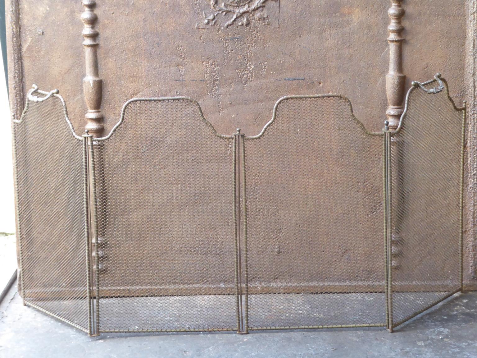 19th century French Napoleon III four panel fireplace screen. The screen is made of iron and iron mesh. It is in a good condition and is fit for use in front of the fireplace.