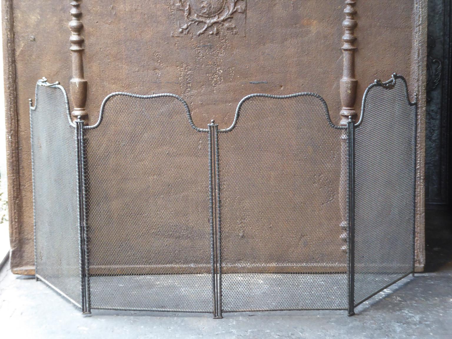 19th century French Napoleon III four panel fireplace screen. The screen is made of brass, iron and iron mesh. It is in a good condition and is fit for use in front of the fireplace.