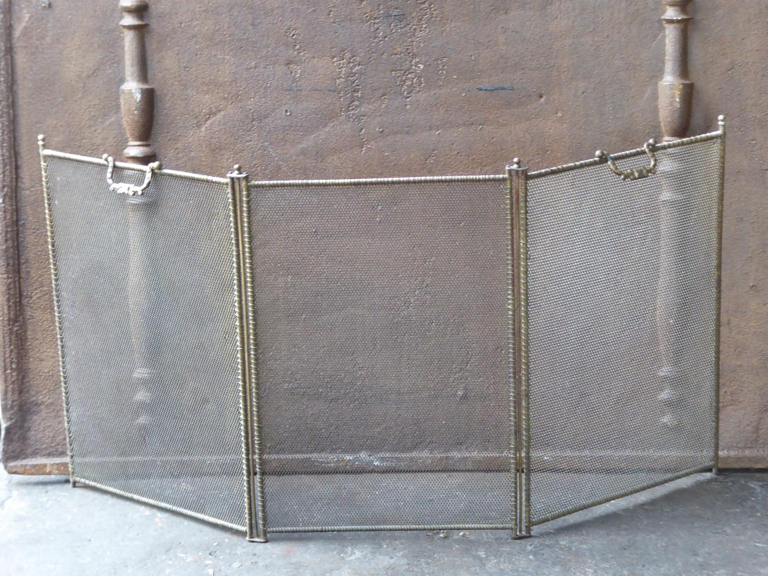 19th century French Napoleon III three-panel fireplace screen. The screen is made of brass, iron and iron mesh. It is in a good condition and is fit for use in front of the fireplace.
