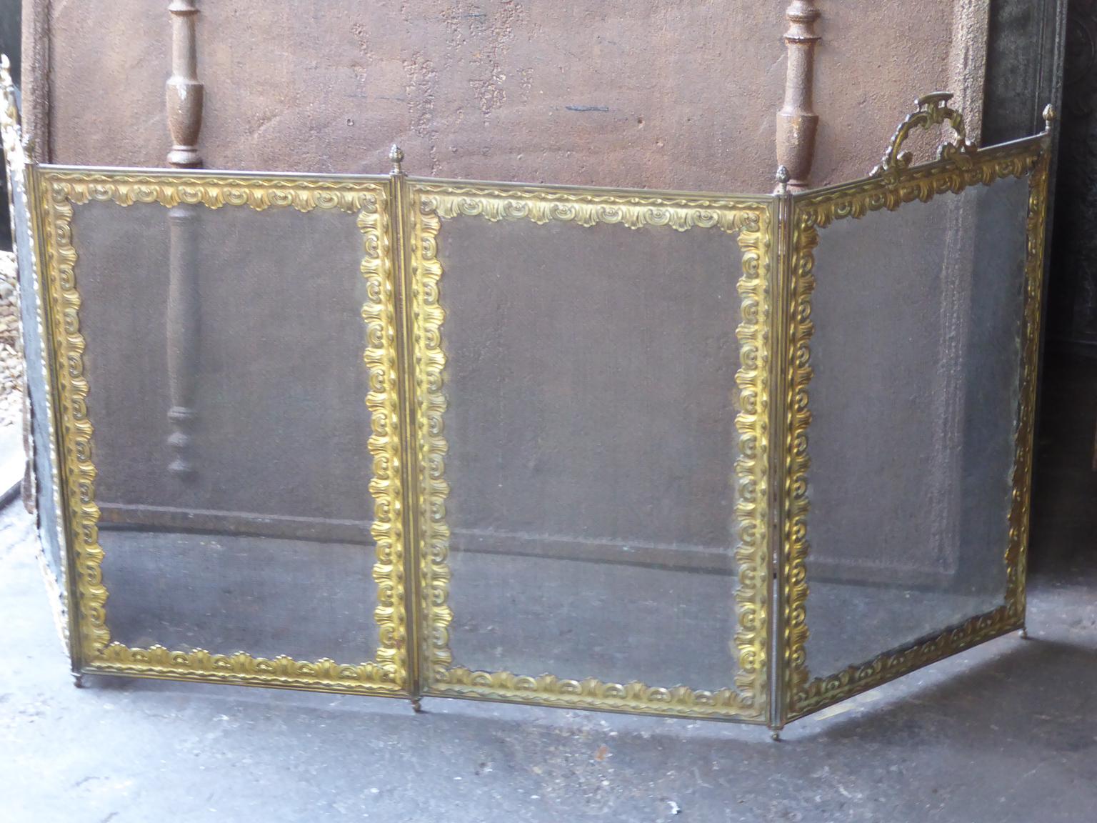 Beautiful 19th century French Napoleon III four panel fireplace screen. The screen is made of brass, ormolu and iron mesh. It is in a good condition and is fit for use in front of the fireplace.