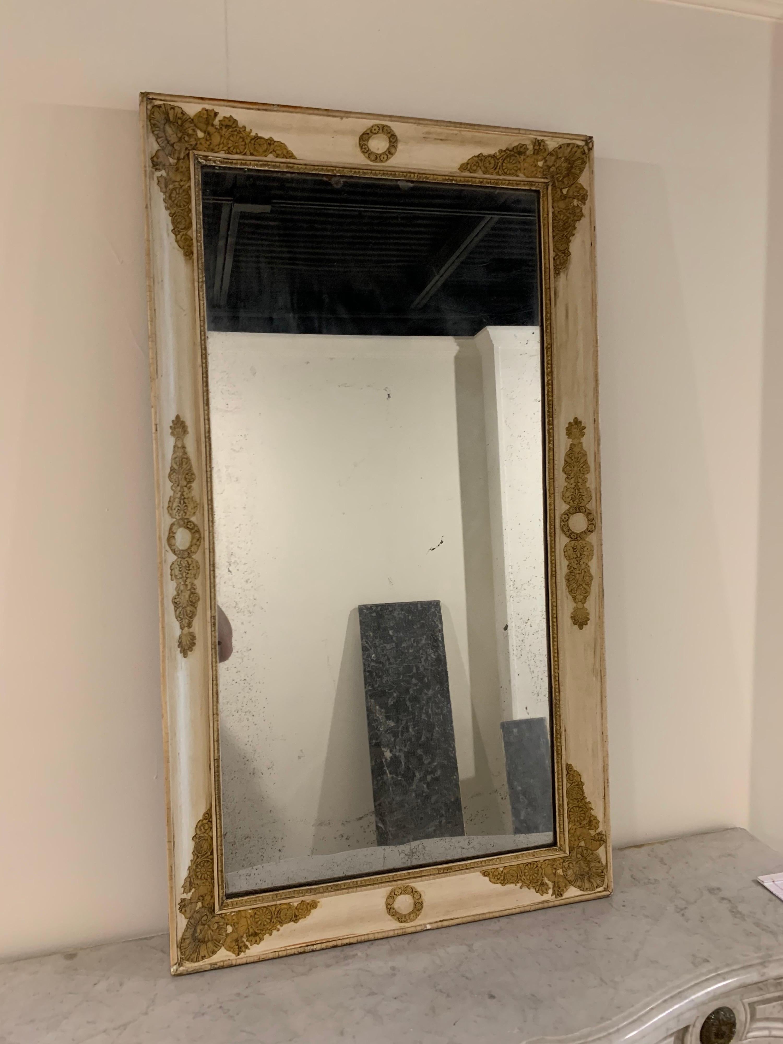 Stunning 19th century French Napoleon III Gesso mirror with original mercury glass. Beautiful decorative carved details in an antique gold color. So pretty!