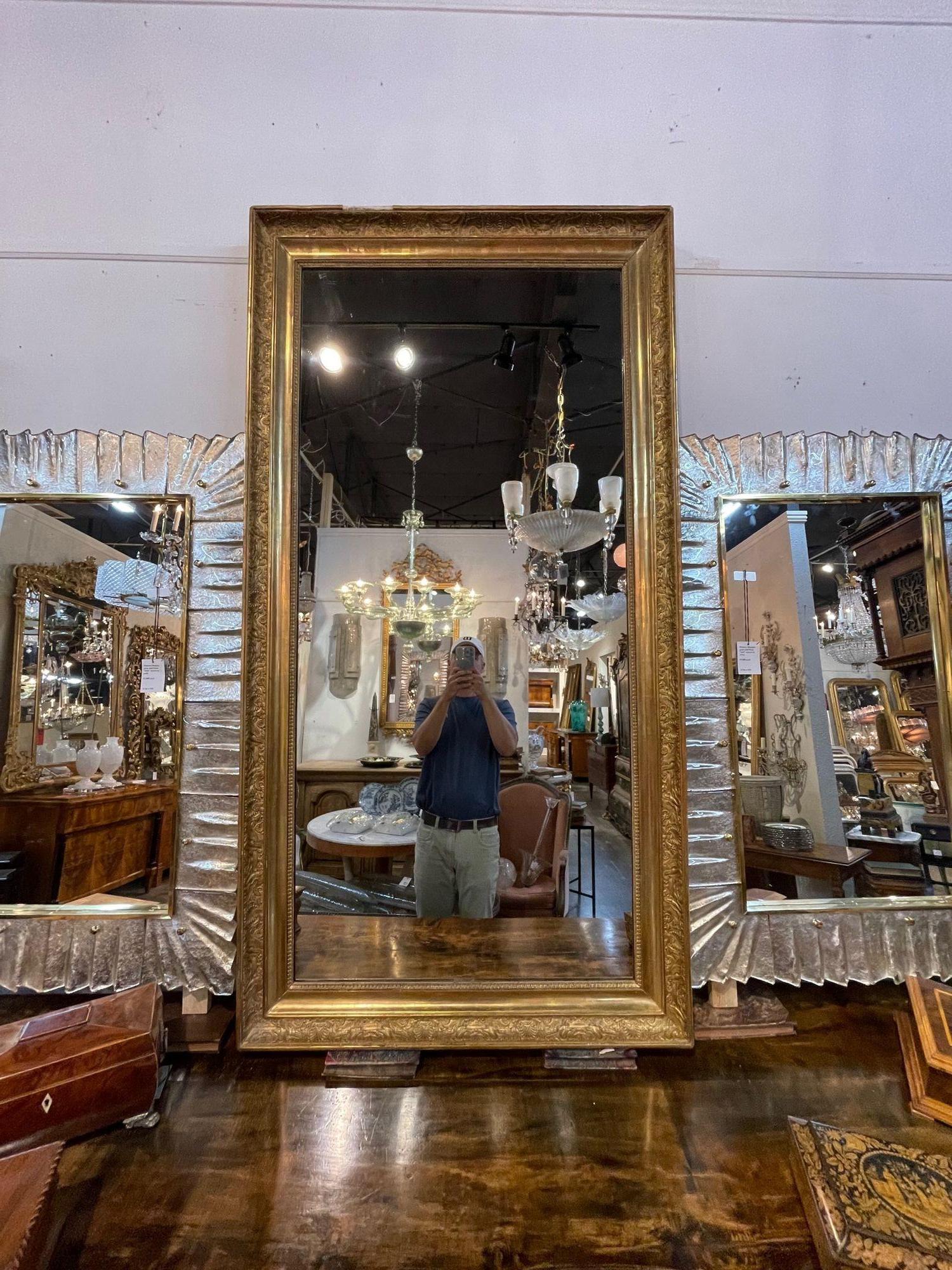 Very fine 19th century Napoleon III giltwood mirror. Featuring a lovely decorative pattern and a beaded inner border. A beautiful mirror that makes a real statement!
Note: A minor restoration needs to be done at the top of the mirror.