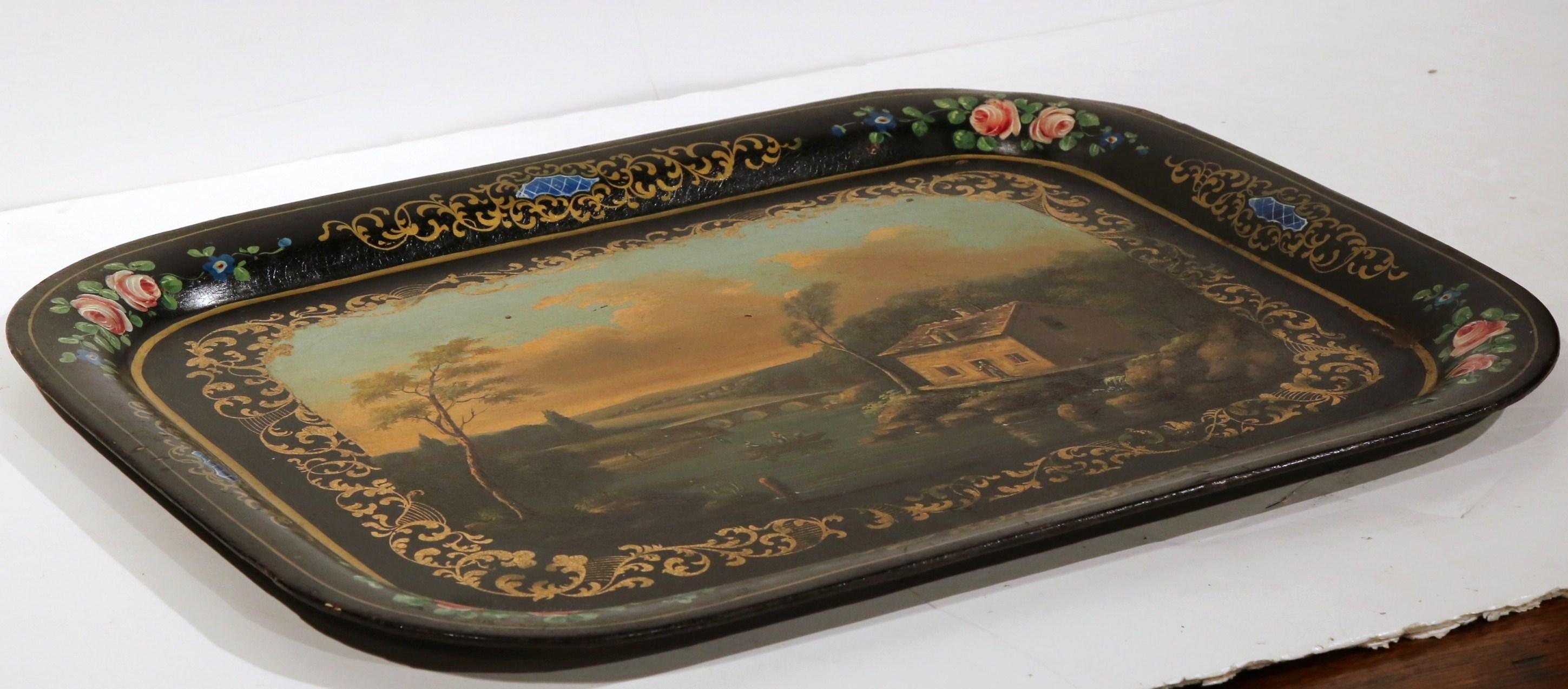 This elegant, hand painted rectangular tray was crafted in France, circa 1870. The colorful, antique platter features a picturesque, hand painted pastoral scene with a lake, bridge and farm. The composition is in excellent condition, and has