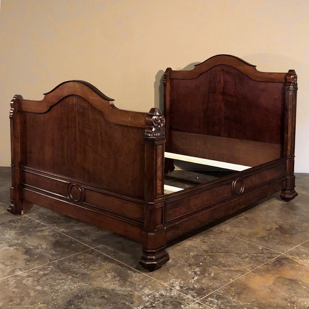 19th century French Napoleon III mahogany day bed is a masterful study in classical architecture melded with timeless French craftsmanship and an understated elegance that will transform your room! Subtly carved end post tops complement the tailored