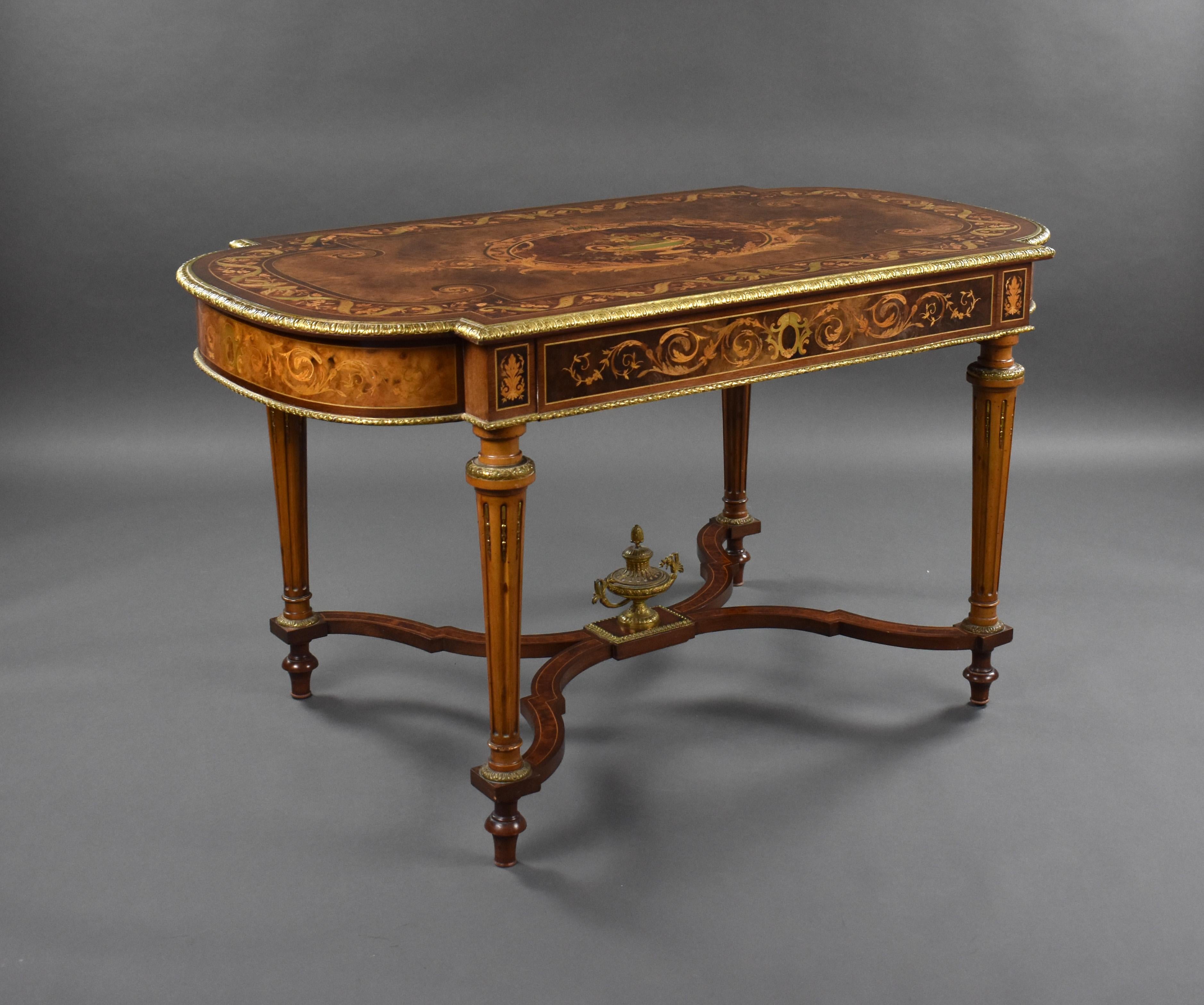 For sale is a fine quality 19th century French marquetry centre table, the top vneered and profusely inlayed with burr walnut, burr yew, amaranth, birds eye maple and stained sycamore. Decorated throughout with gilt metal mounts. The table remains