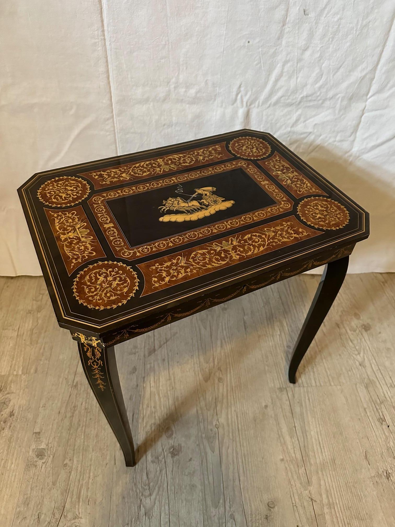 Very nice musical side table dating from the Napoleon III period in good condition.
Decorated with scrolls and horse-drawn chariot in the center.
The top opens and you can discover several compartments.
Below there is a small key which, when turned,