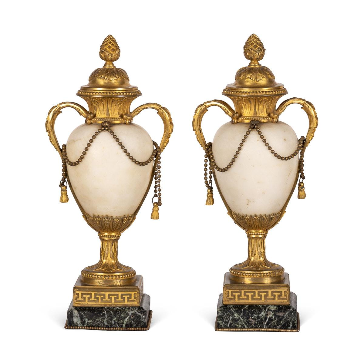 Antique Mid-19th century French Ormolu mounted on white marble urns on green marble bases.

CONDITION
In Great Condition - No Damage.

Size
Height: 36cm
Width: 15.5cm
Depth: 15.5cm.