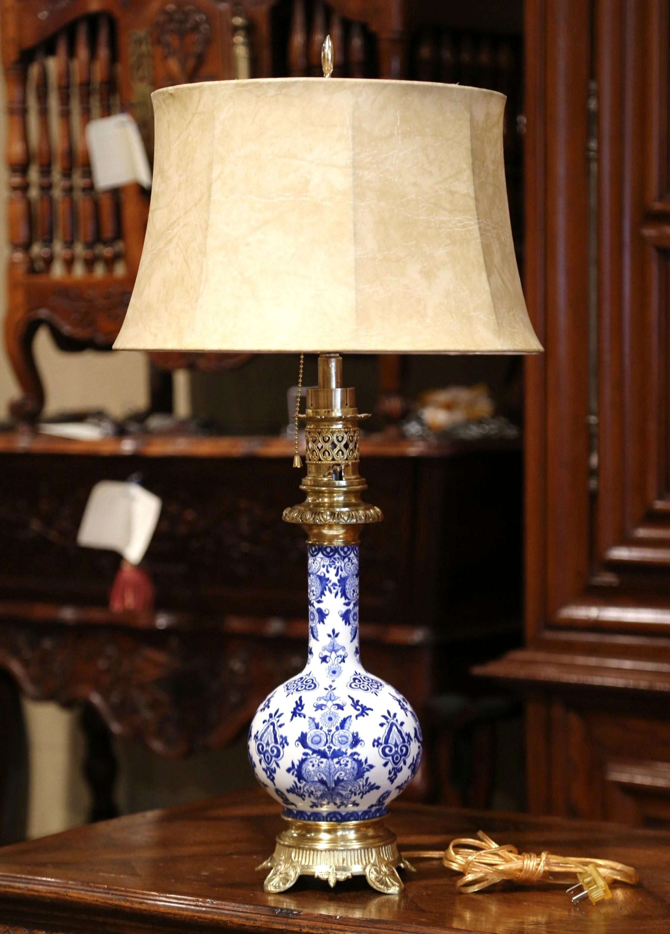 This elegant antique oil lamp was converted into a table lamp. Crafted in France, circa 1880, the tall porcelain 
