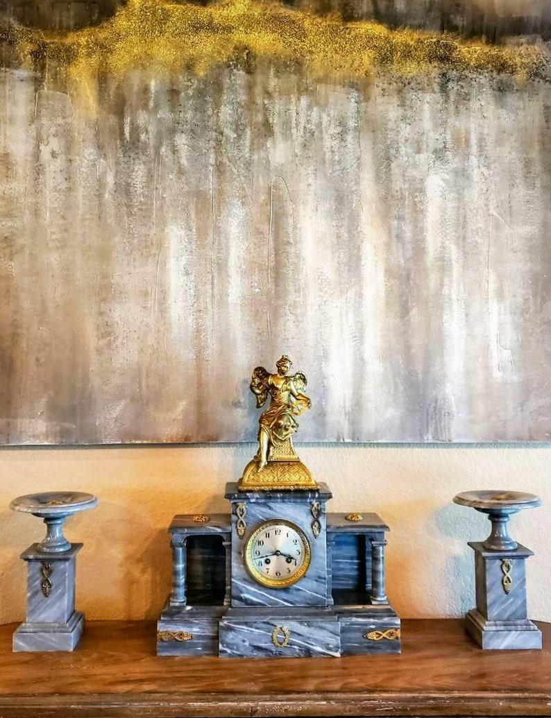A fabulous over one hundred and sixty year old Parisian neoclassical style Bardiglio marble three piece mantel set. 

Born in Paris, France in the mid 19th century, featuring an ancient first century AD Roman villa inspired architectural case,