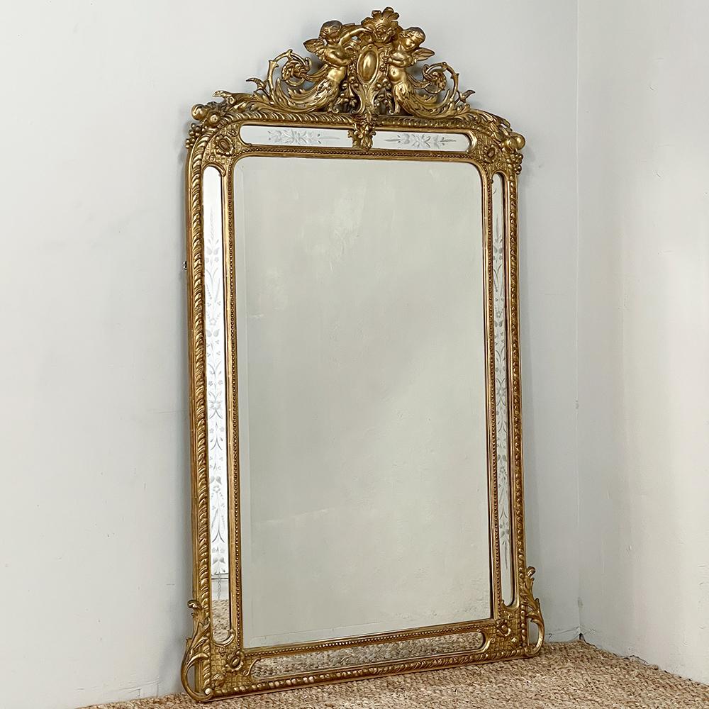 19th Century French Napoleon III Period Gilded mirror is a stunning representation of the pinnacle of artistry in decor that defined the second French empire! The main beveled mirror remains in very good condition, obviously well preserved over the