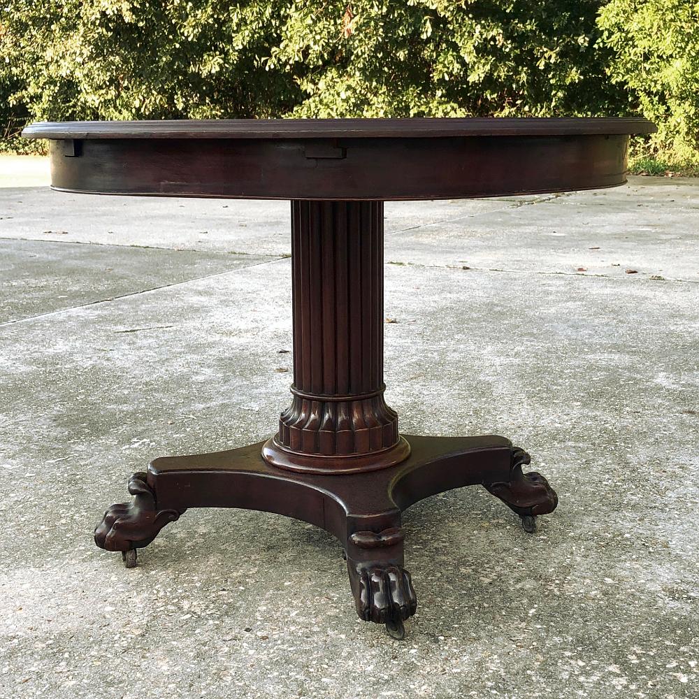 19th century French Napoleon III Period mahogany center table was designed to impress visitors immediately upon entering a gracious home! Usually decorated with a vase of fresh flowers or statuary, it would reside just inside the main entrance. The