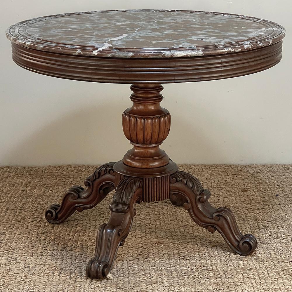 19th Century French Napoleon III Period Marble Top Center Table was designed to add beauty to a home, most specifically an impressive entry, meant for a foyer or stairwell.  The luxuriously veined Griotte marble top was cut with 
