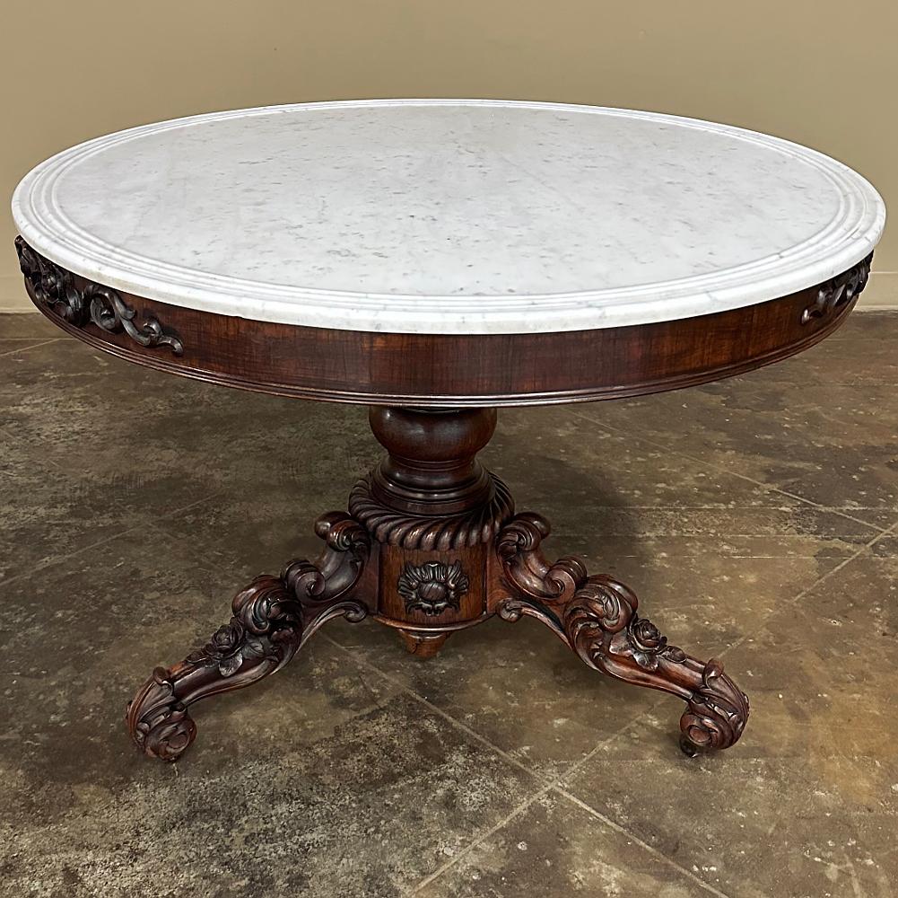 19th Century French Napoleon III Period Walnut Center Table with Original Carrara Marble is a magnificent representation of the era during which France's last monarch revived every French style since the origins of the Gothic design in the mid-12th