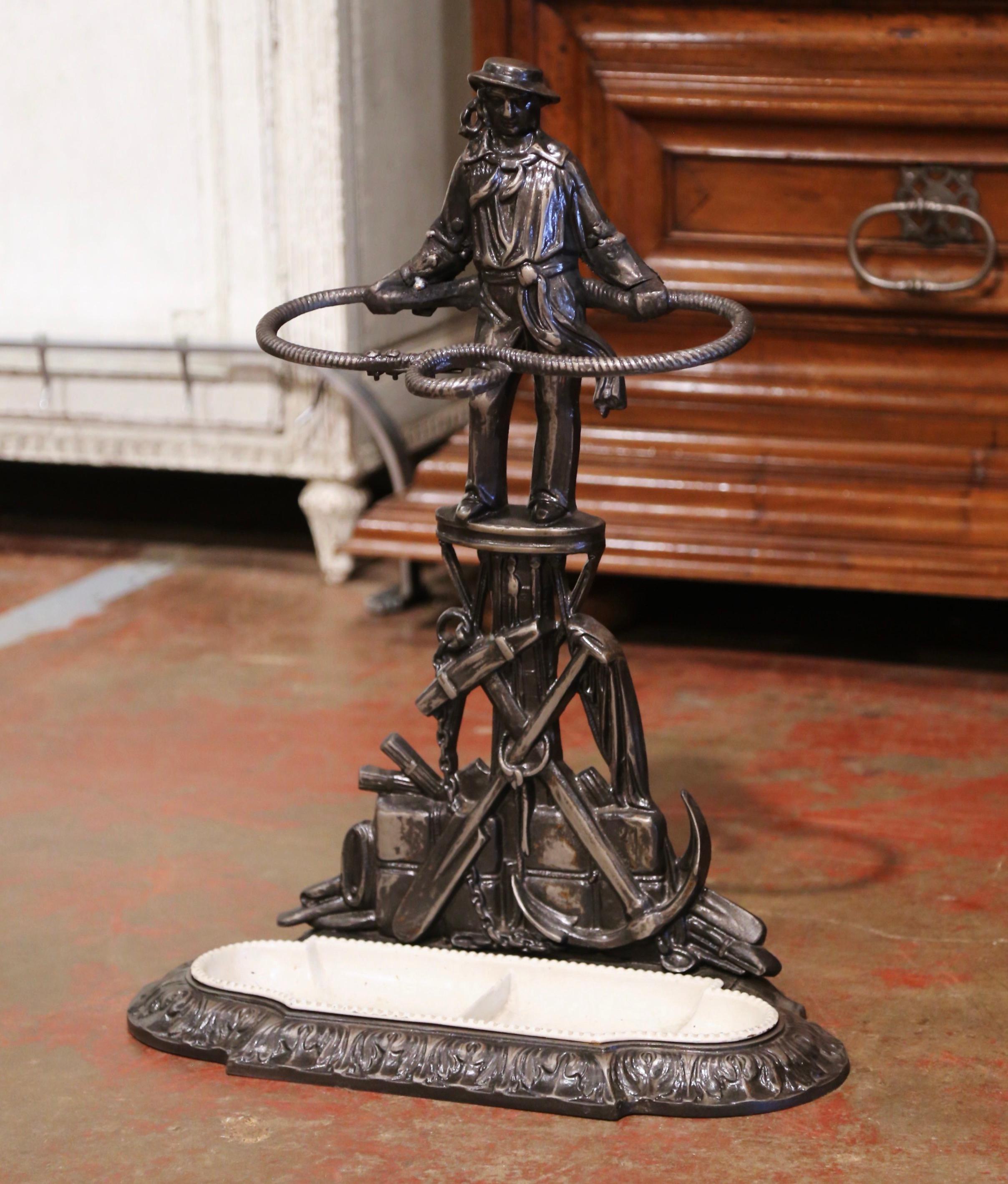 Dress an entry way with this fine antique umbrella or cane stand. Crafted in Brittany, France circa 1870, the freestanding stand is decorated with a French revolution royalist, a 
