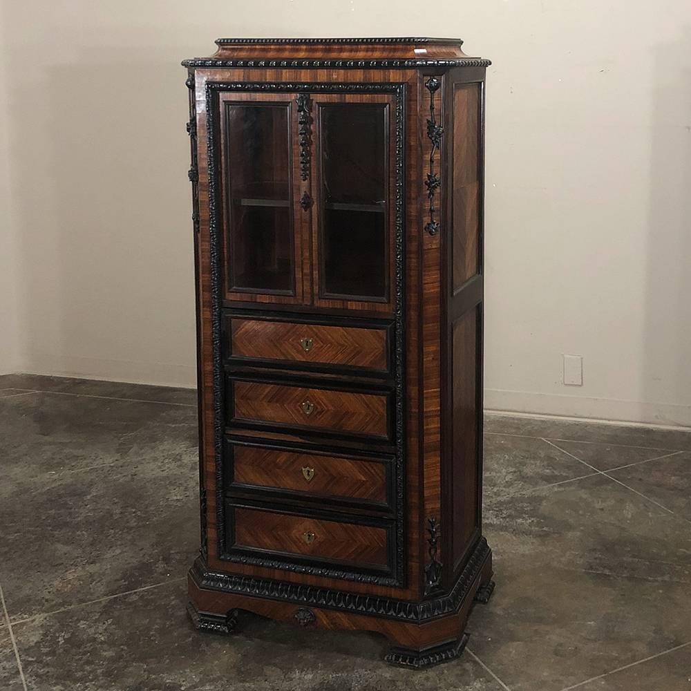 Designed to display a collection, family photos, as well as store fine clothing, such 19th century French Napoleon III Period rosewood ebonized vitrine - Curio cabinets as this example were also very commonly used as linen presses in the dining
