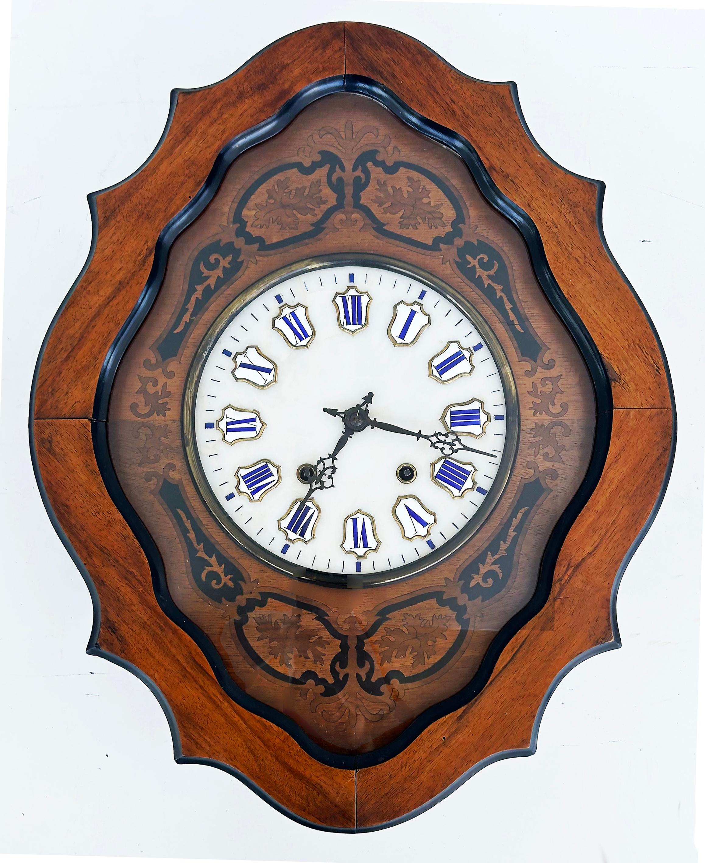 19th Century French Napoleon III Wall Clock, Enamel Face and Wood Marquetry 

Offered for sale is a 19th-century French Napoleon III wall clock acquired in the  Pyrenees region of France bordering Spain.  This lovely wall clock is from the mid to
