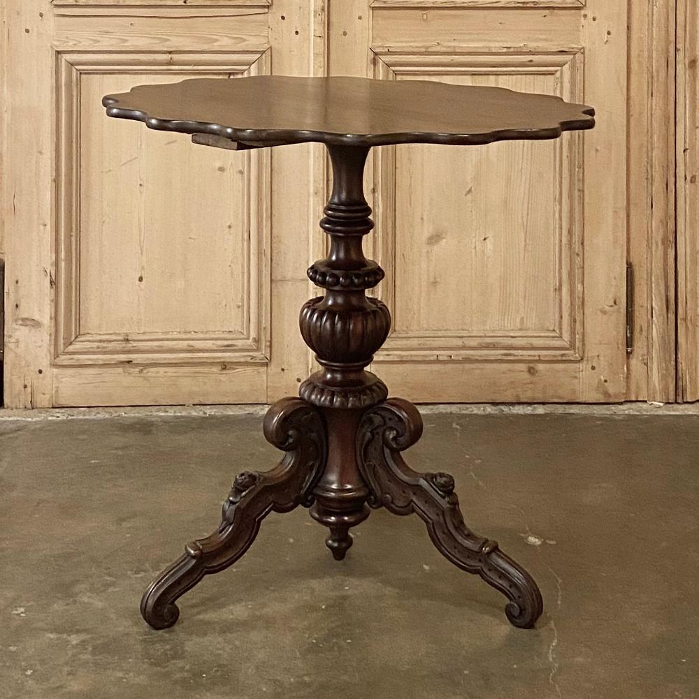 19th Century French Napoleon III Walnut Pie Crust Center Table, so called because of the shape of the contours around the tabletop, is a wonderful example of French craftsmanship! Utilizing hand-selected, luxuriously grained walnut, the artisans