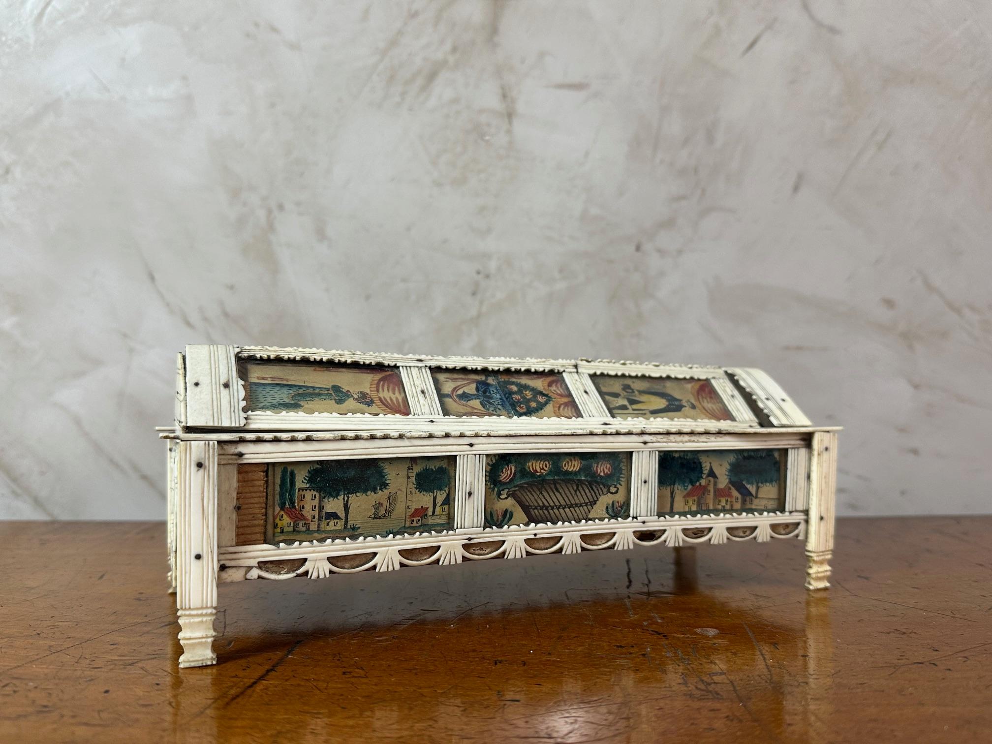 Beautiful and rare 19th-century domino set made by a prisoner of war in the 1820s.
Entirely hand-carved and painted, depicting a bourgeois, young women, seascapes, bouquets of flowers, and more. 
This piece shows a remarkable quality and
