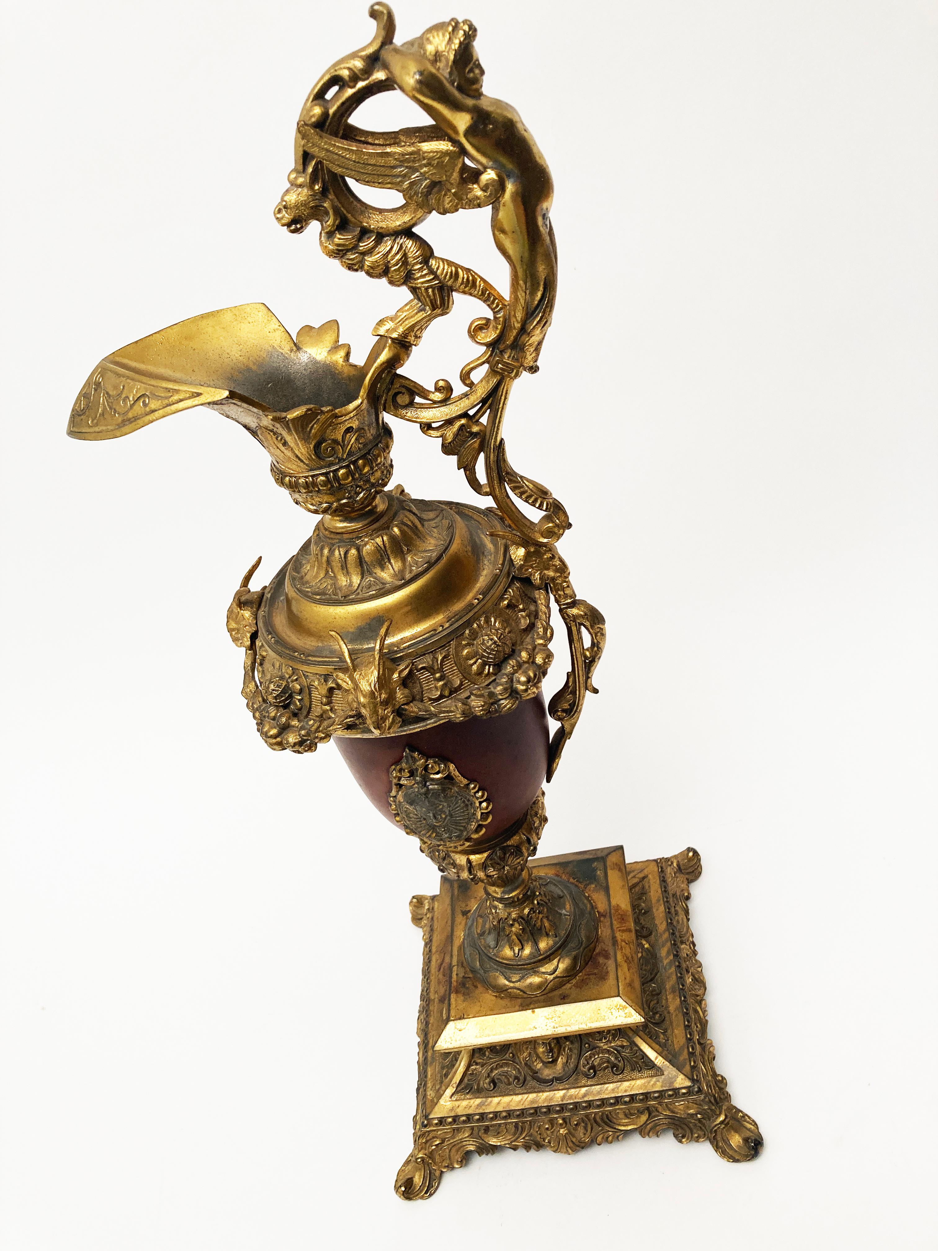 This ewer is a stunning decorator item! The attention to detail from this era is nothing short of exquisite. From the beautiful cherub that adorns the handle to the rams heads, every tiny detail is a work of art. This piece would be a wonderful